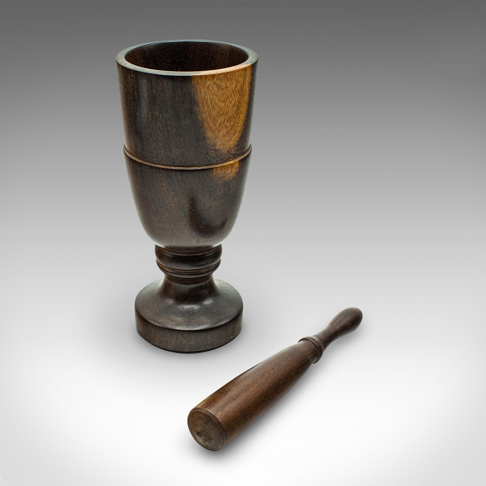 
This is an vintage mortar and pestle. An English, turned walnut apothecary or kitchen aid, dating to the late 20th century, circa 1970.

Charming wood turned set, with a great visual appearance
Displays a desirable aged patina and in good
