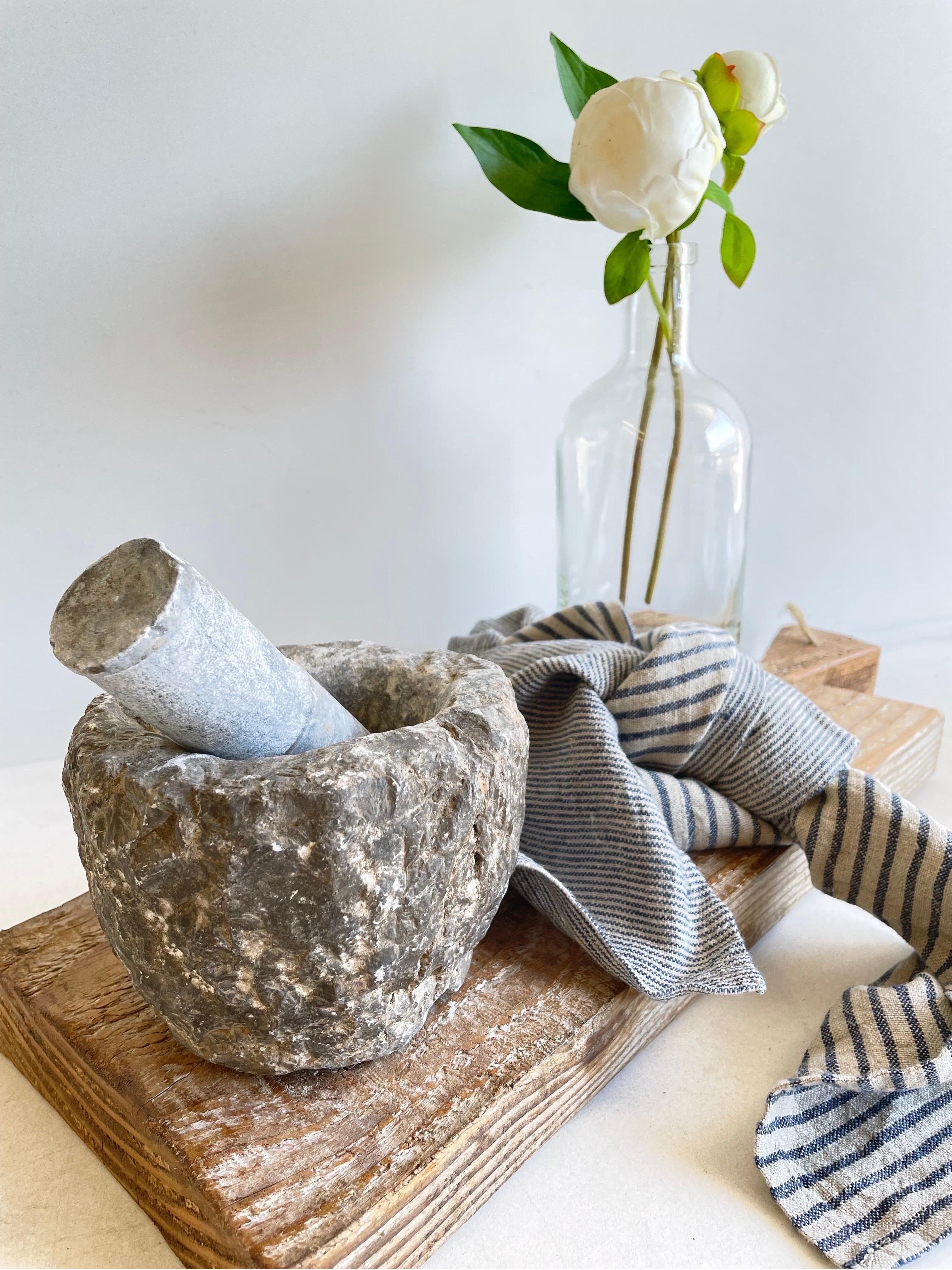 Antique stone mortar and pestle bowl set, great decorative item, or can be used. Accessories not included
Size: 4”H x 5 1/2”D x 3”Opening.