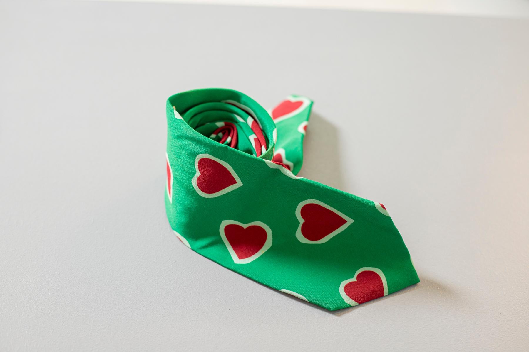 Nice and quirky, this tie is designed by the famous Italian designer Moschino. It is made of silk, decorated with red hearts on a bright green background. Ideal for a romantic evening showing your nice side. We recommend combining it with a shirt