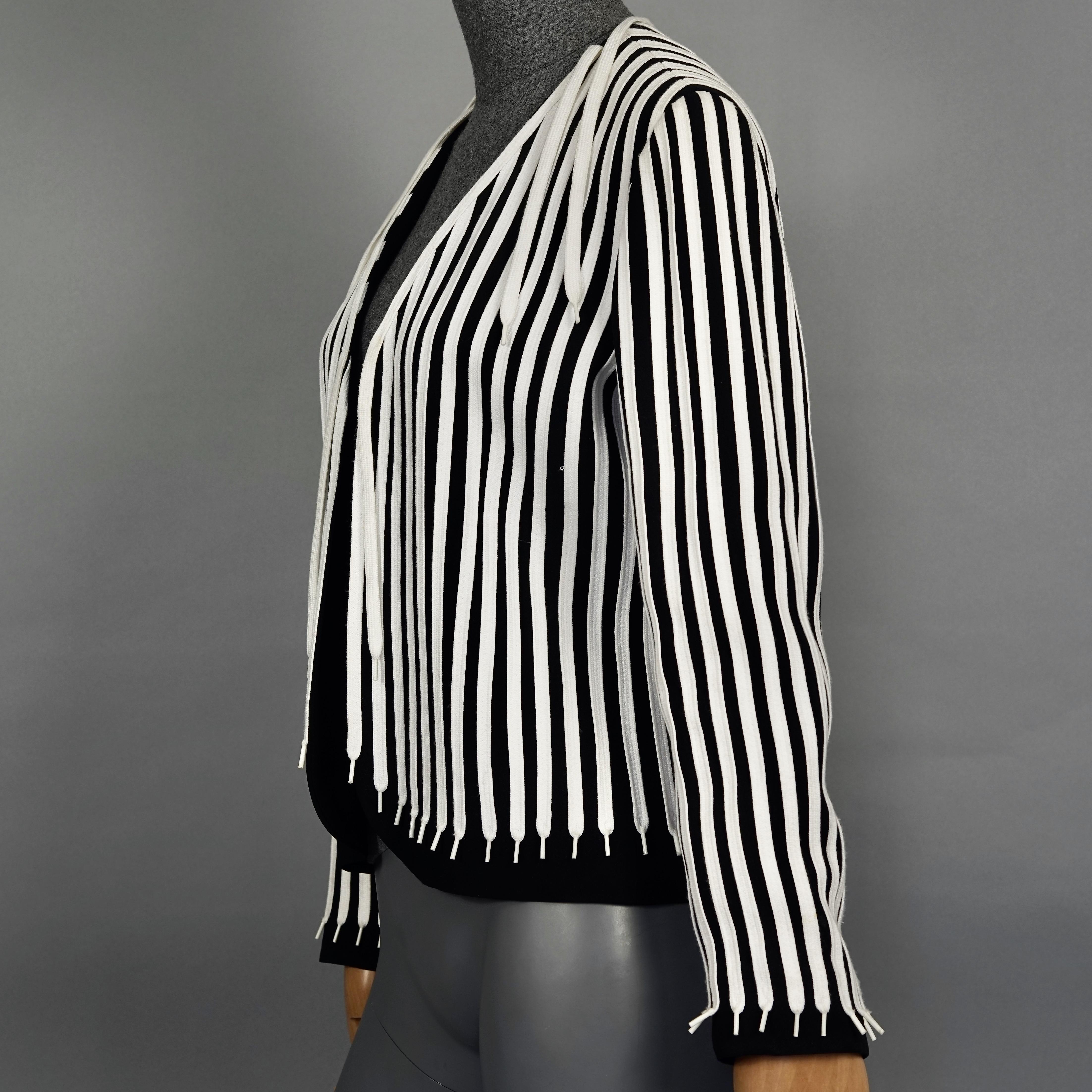 Vintage MOSCHINO CHEAP and CHIC Black and White Shoestrings Novelty Blazer Jacket

Measurements taken laid flat, please double bust and waist:
Shoulder: 16.33 inches (41.5 cm)
Sleeves: 22.63 inches (57.5 cm)
Bust: 18.50 inches (47 cm)
Waist: 15.75