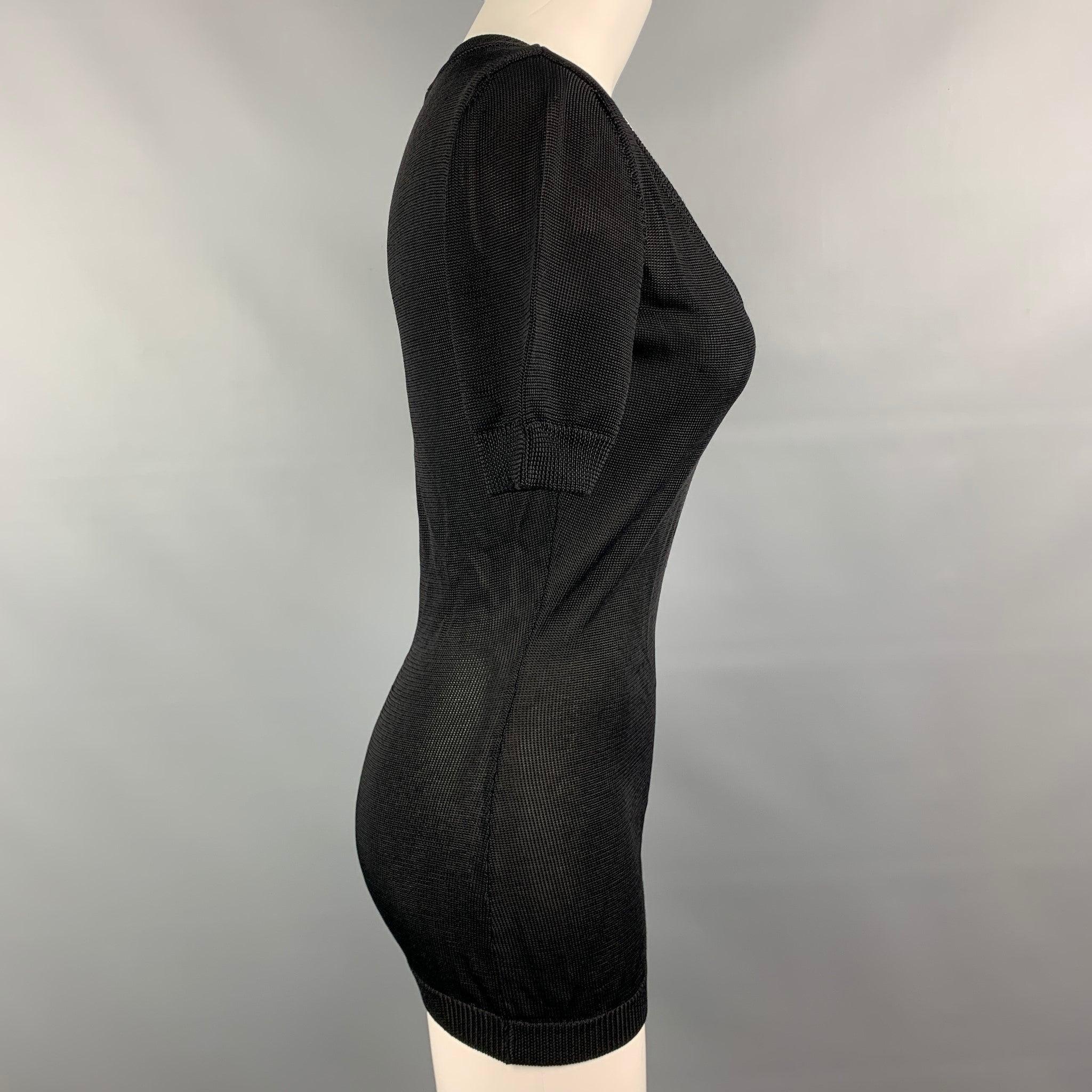 Vintage MOSCHINO COUTURE pullover comes in a black knitted rayon featuring short sleeves and a scoop neckline. Made in Italy.Very Good
 Pre-Owned Condition. 
 

 Marked:  I 42 / D 38 / F 38 / GB 10 / USA 8  
 

 Measurements: 
  
 Shoulder: 15