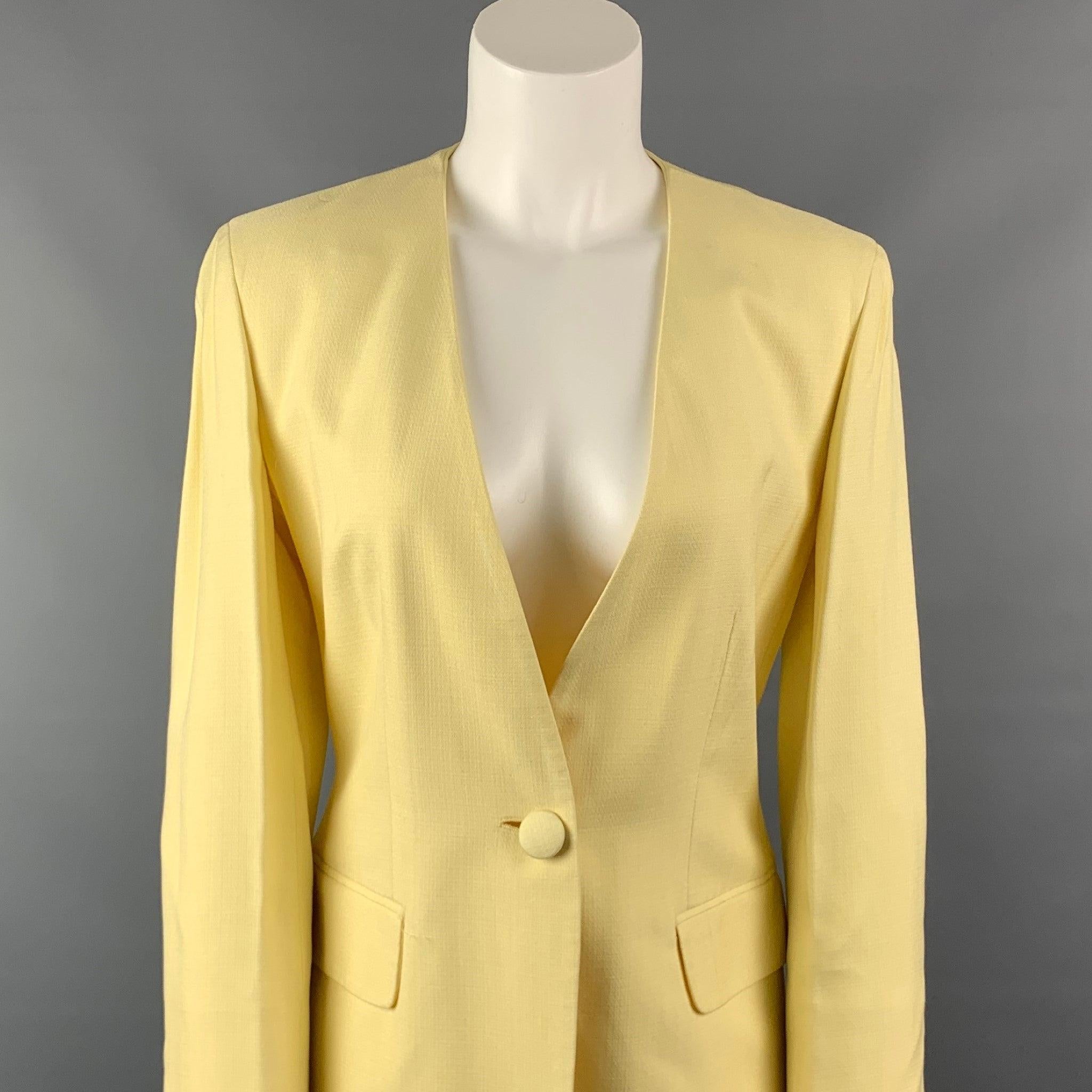 Vintage MOSCHINO COUTURE jacket comes in a yellow acetate blend with a full liner featuring a collarless style, flap pockets, and a single button closure. Made in Italy. Good Pre-Owned Condition. 
 

 Marked:  I 42 / D 38 / F 38 / GB 10 / USA 8 
 

