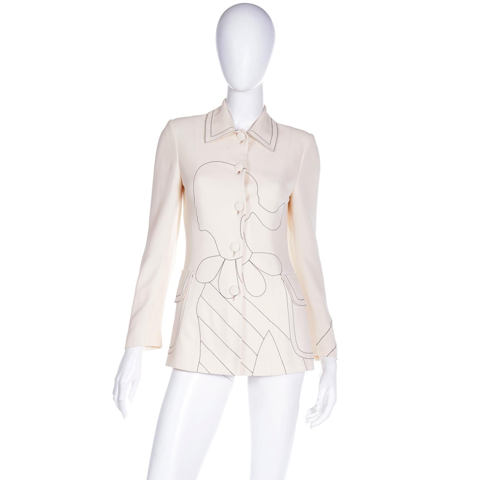 This rare vintage Moschino Cheap and Chic jacket features an embroidered black line drawing of Olive Oyl on the front and the word CIAO! in a thought cloud on the back. Olive Oyl was one of Franco Moschino's favorite cartoon characters and she is
