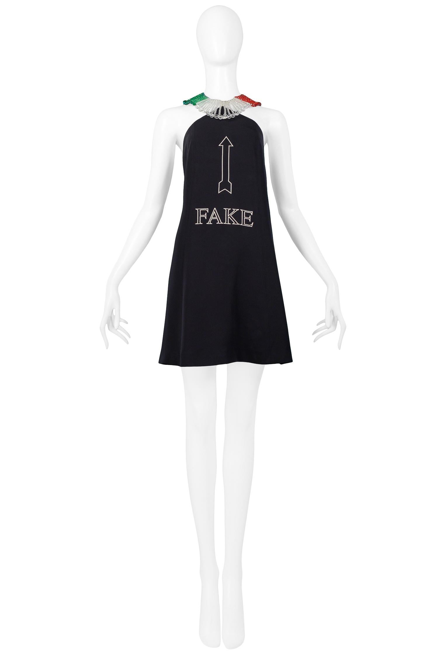 Resurrection Vintage est heureux de vous proposer une mini robe vintage Moschino by Franco Moschino à texte 