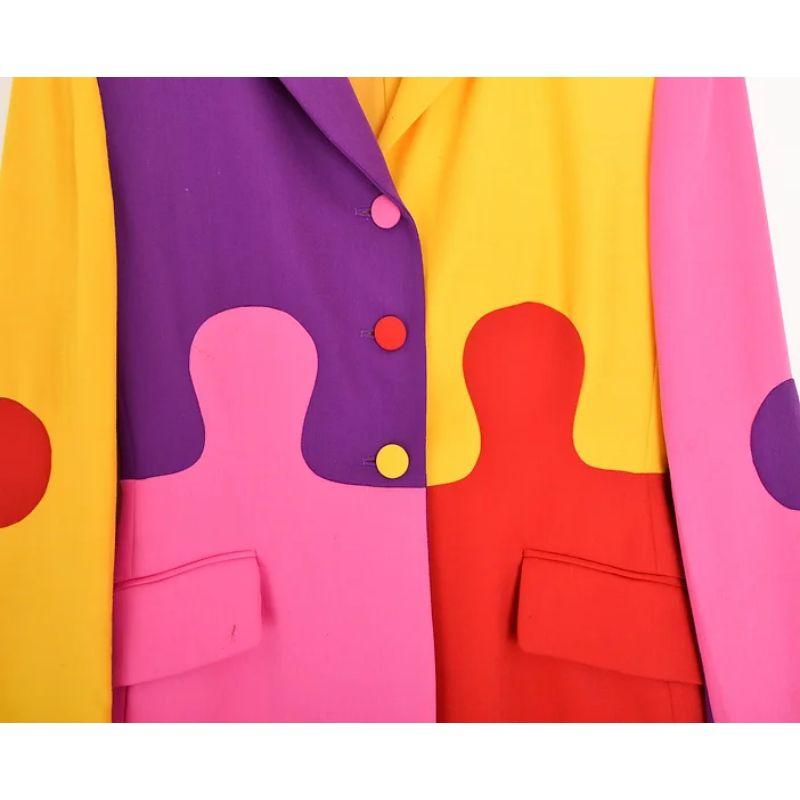 Vintage 1990s Moschino 'Jigsaw Puzzle' blazer !

This Incredible Vintage piece from the 'Cheap & Chic' collection features immaculately cut, colourful jigsaw-puzzle shaped panelling in Various Primary Colours. 

MADE IN ITALY

Features:
Central line