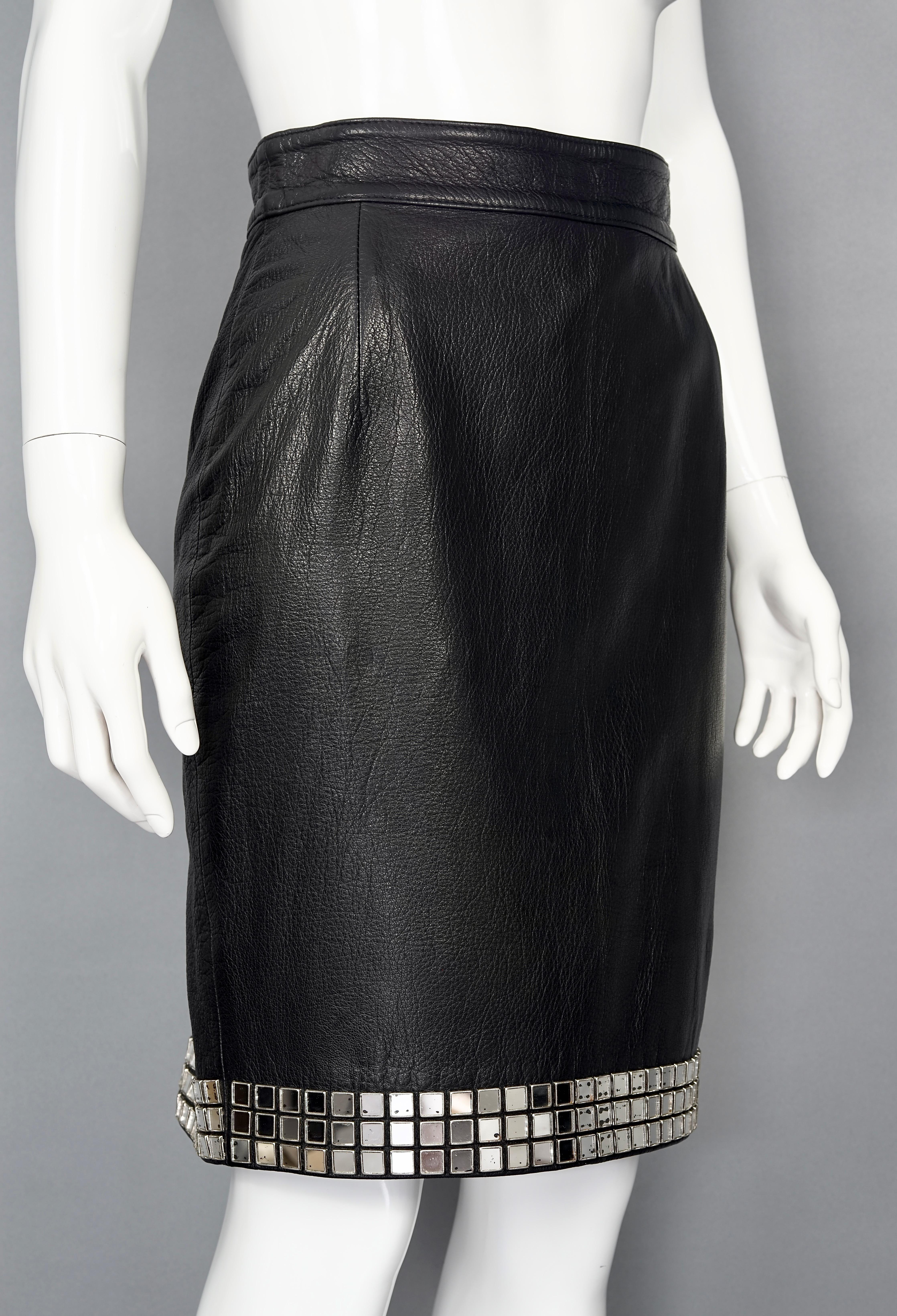 Vintage MOSCHINO Mirror Applique Leather Skirt

Measurements taken laid flat, please double waist:
Waist: 14.17 inches (36 cm)
Hips: 19.29 inches (49 cm)
Length: 21.25 inches (54 cm)

Features:
- 100% Authentic MOSCHINO LEATHER.
- Black leather