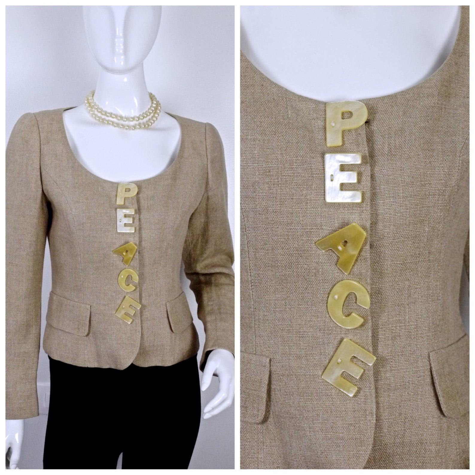 Vintage MOSCHINO PEACE Novelty Linen Jacket

Measurements taken laid flat, please double bust and waist:
Shoulder: 14.5 inches
Sleeves: 24 inches
Bust: 17.5 inches
Waist: 15 inches
Length: 20.5 inches

Features:
- 100% Authentic MOSCHINO.
- Big