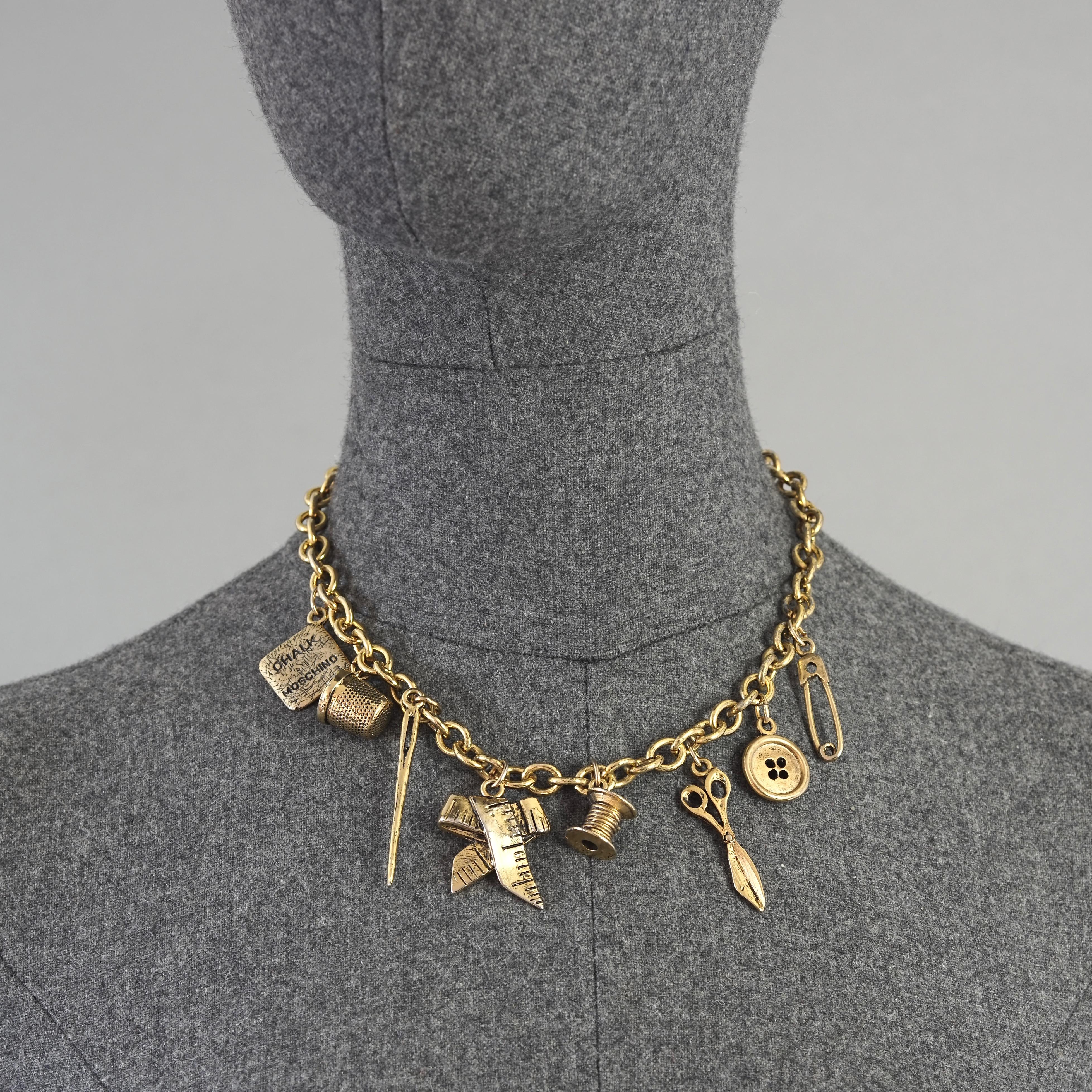 Vintage MOSCHINO Tailor's Sewing Tools Charm Necklace

Measurements: 
Height: 2.36 inches (6 cm)
Wearable Length: 16.53 inches (42 cm)

Features:
- 100% Authentic MOSCHINO.
- Tailor's essential sewing tools charm novelty necklace.
- Charms: tailor's