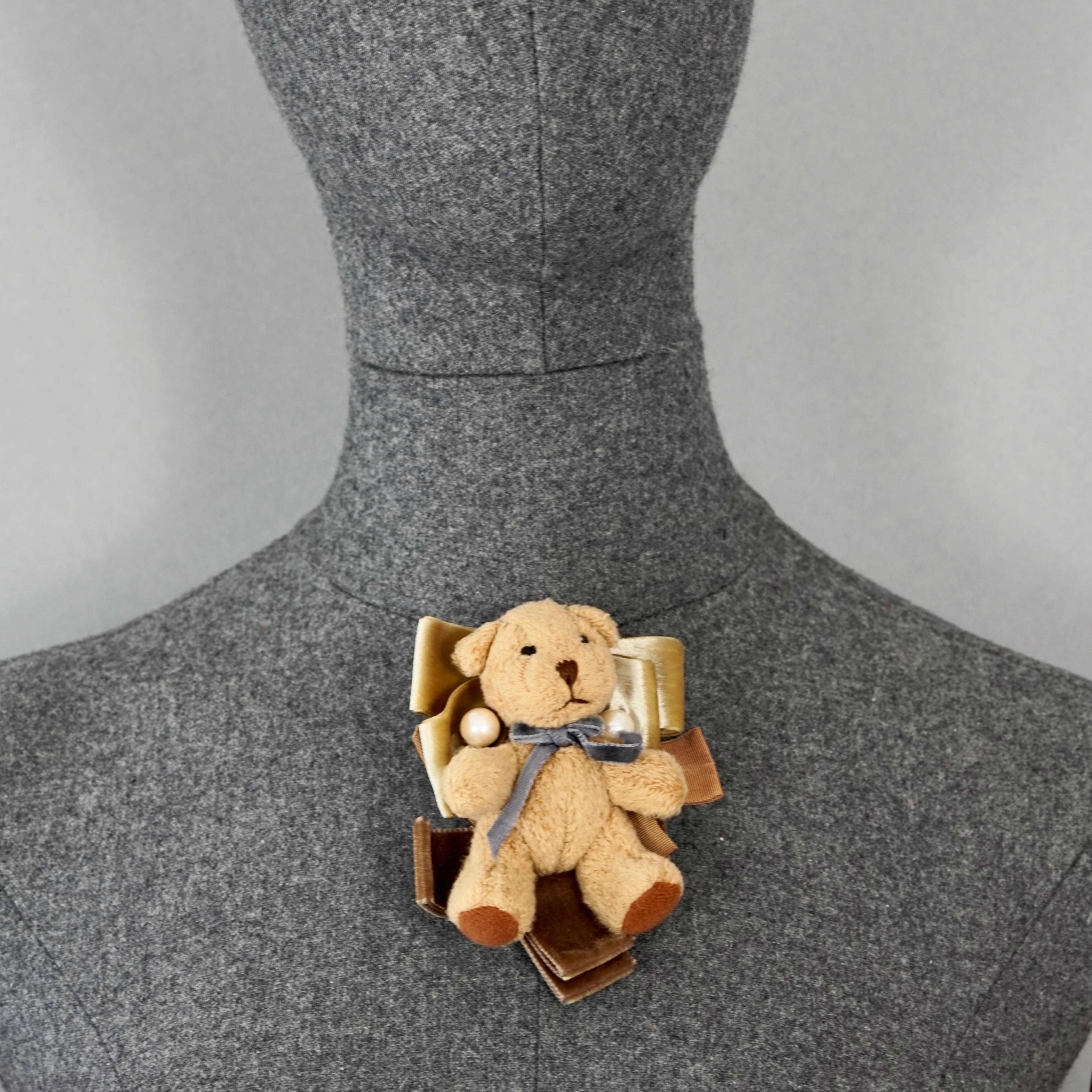 Vintage MOSCHINO Teddy Bear Novelty Brooch

Measurements: 
Height: 3.94 inches (10 cm)
Width: 3.35 inches (8.5 cm)

Features:
- 100% Authentic MOSCHINO.
- Plush teddy bear brooch.
- Signed MOSCHINO on reverse.