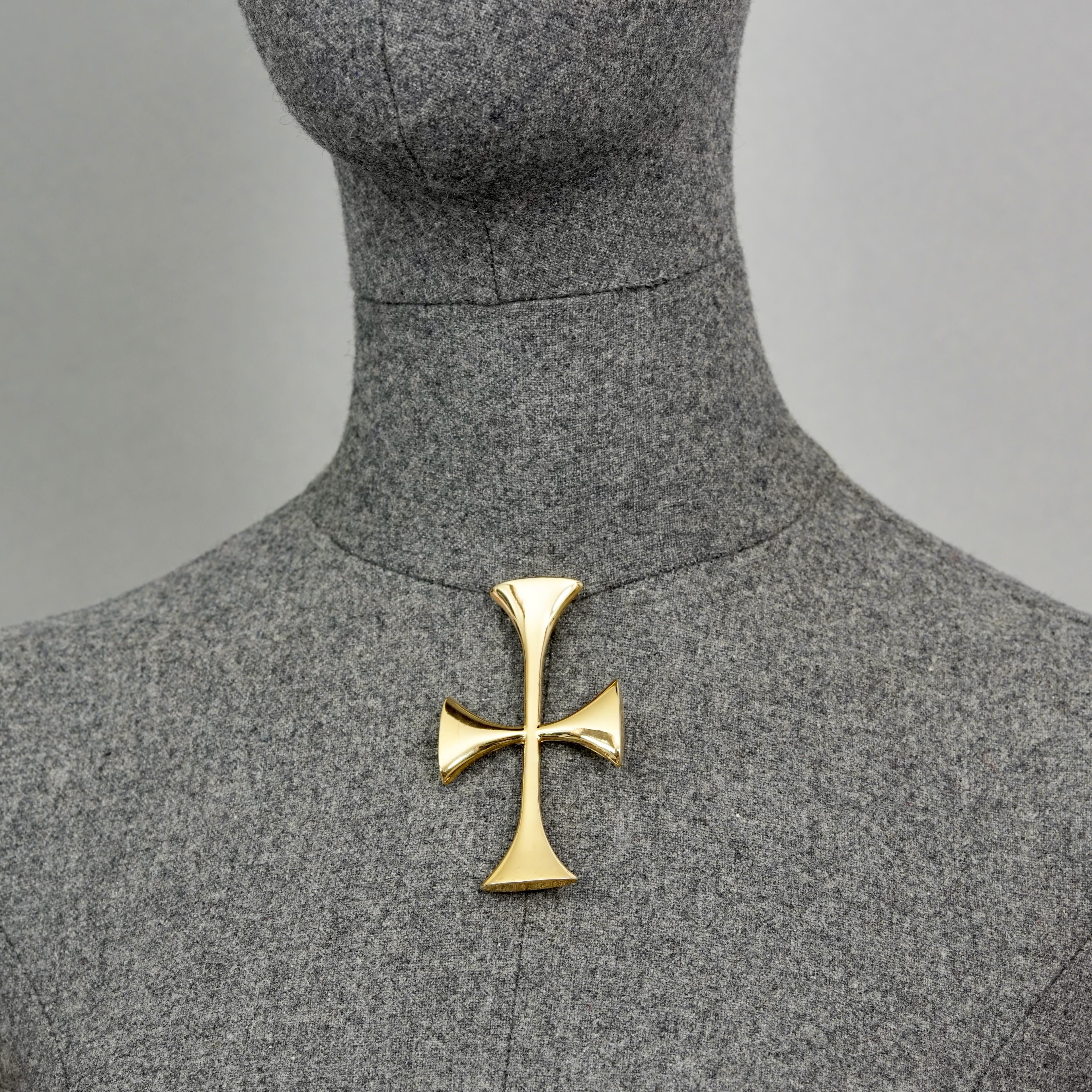 Vintage MOSCHINO Templar Cross Novelty Brooch

Measurements: 
Height: 3.15 inches (8 cm)
Width: 1.57 inches (4 cm)

Features:
- 100% Authentic MOSCHINO.
- Novelty templar cross brooch.
- Gold tone hardware.
- Signed MOSCHINO on reverse.