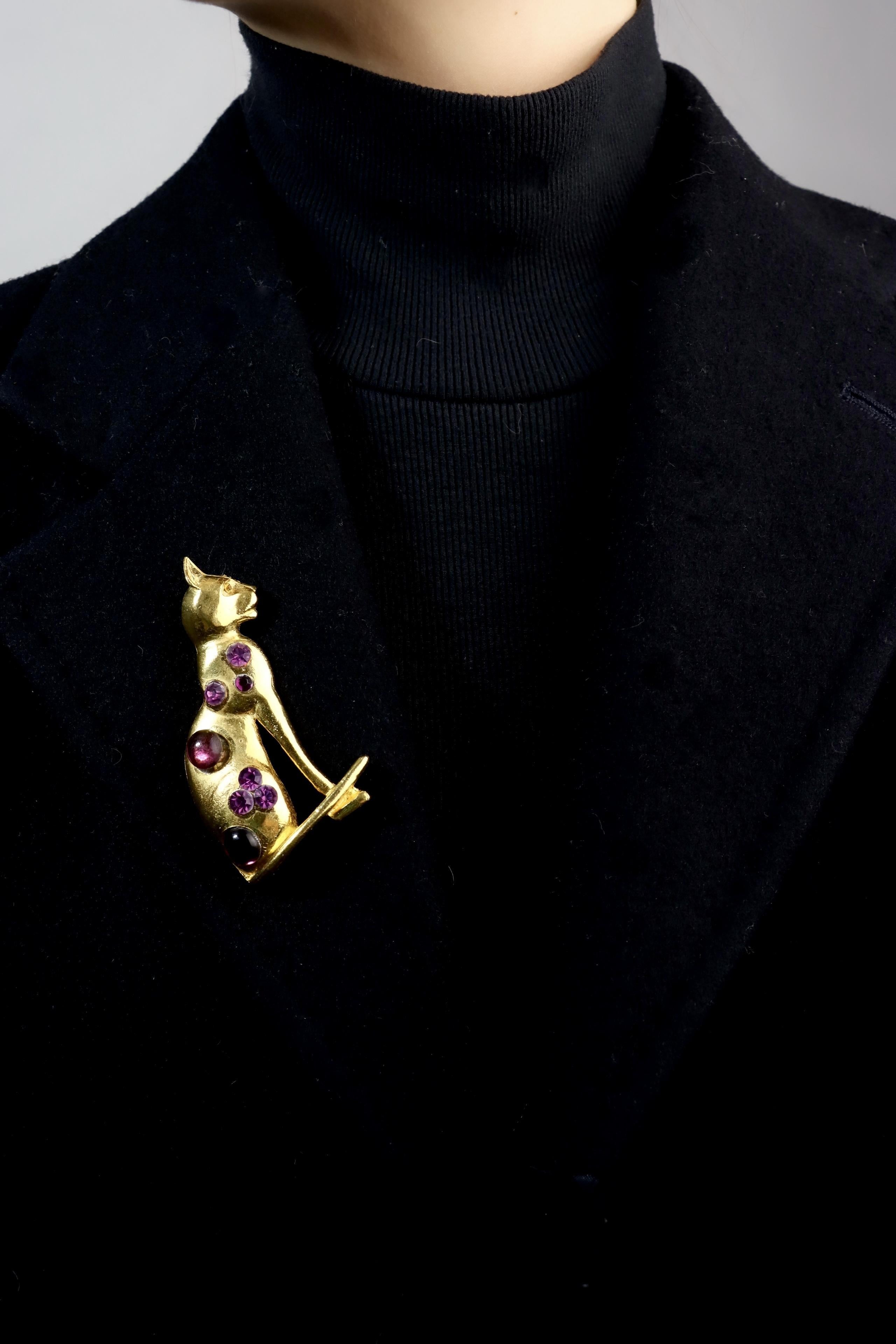 Vintage MOSELL Gold Tone Purple Rhinestone Cat Pendant 

Marked:
MOSELL

Approximate Dimensions:
7 cm (Length) 
4 cm (Width
31.7 grams in weight.