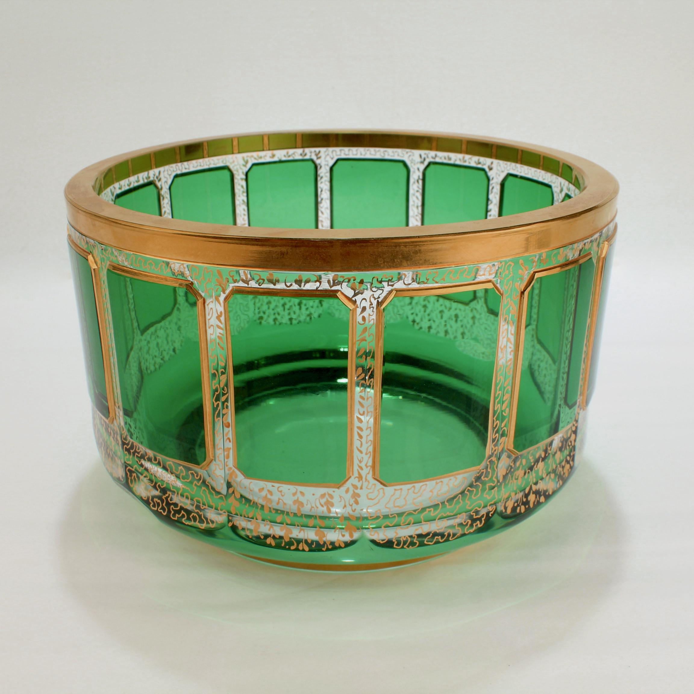 A fine vintage Bohemian art glass bowl.

With large green cabochons around its circumference and rich gilt decoration.

Attributed to Moser. 

Simply a wonderful glass bowl!

Date:
20th Century

Overall Condition:
It is in overall good,