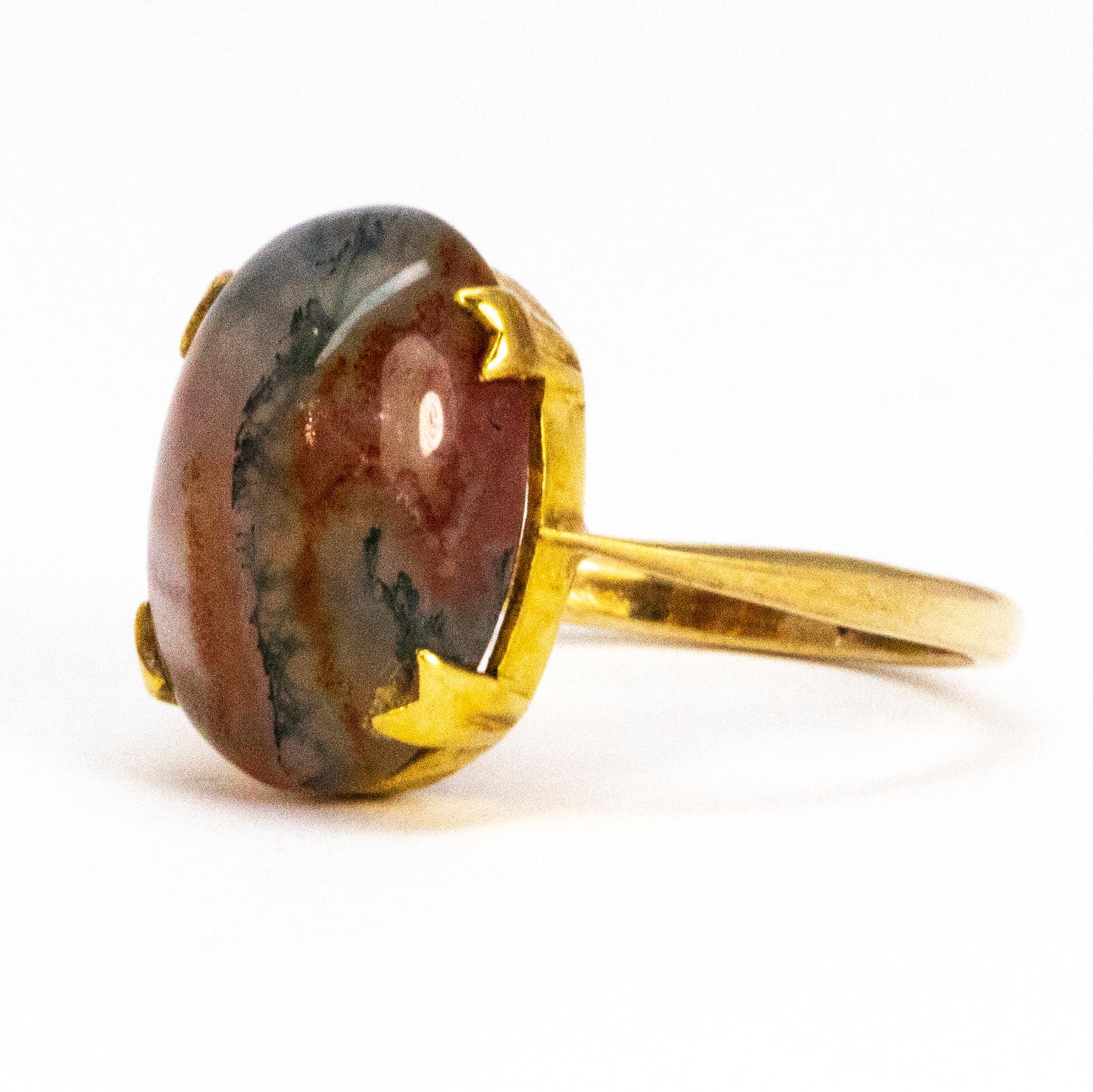 The gorgeously glossy cabochon agate stone in this ring has so many beautiful colours flowing through it. The stone is set using simple claws and the band is fine and delicate, modelled in 9ct gold. 

Ring Size: L 1/2 or 6
Stone Dimensions: 14.5mm x