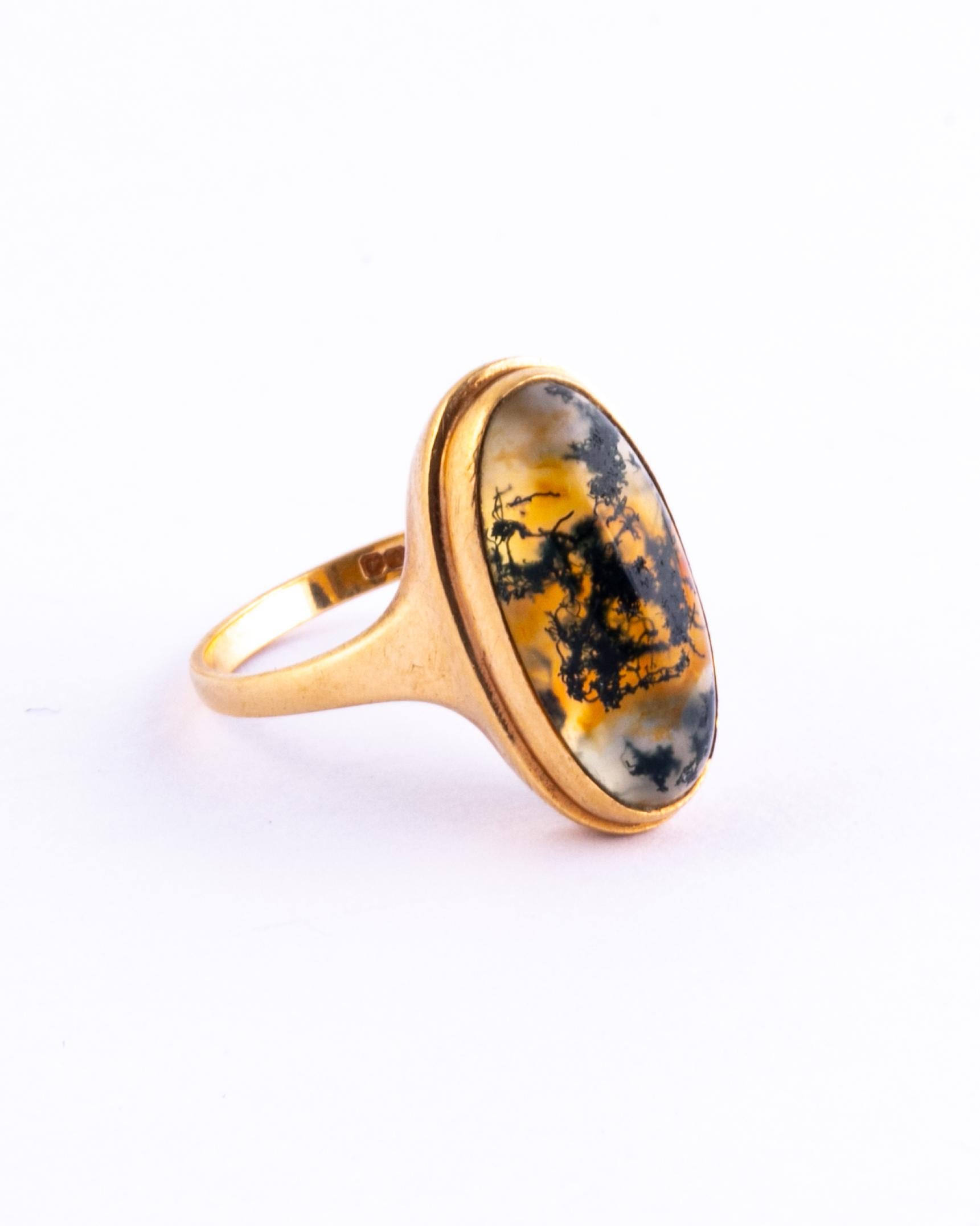 This wonderful moss agate stone has marbling of deep green and amber colour running through. Surrounding the stone there is a simple frame and simple setting. 

Ring Size: O or 7 1/4 
Stone Dimensions: 18x9mm 

Weight: 4.3g