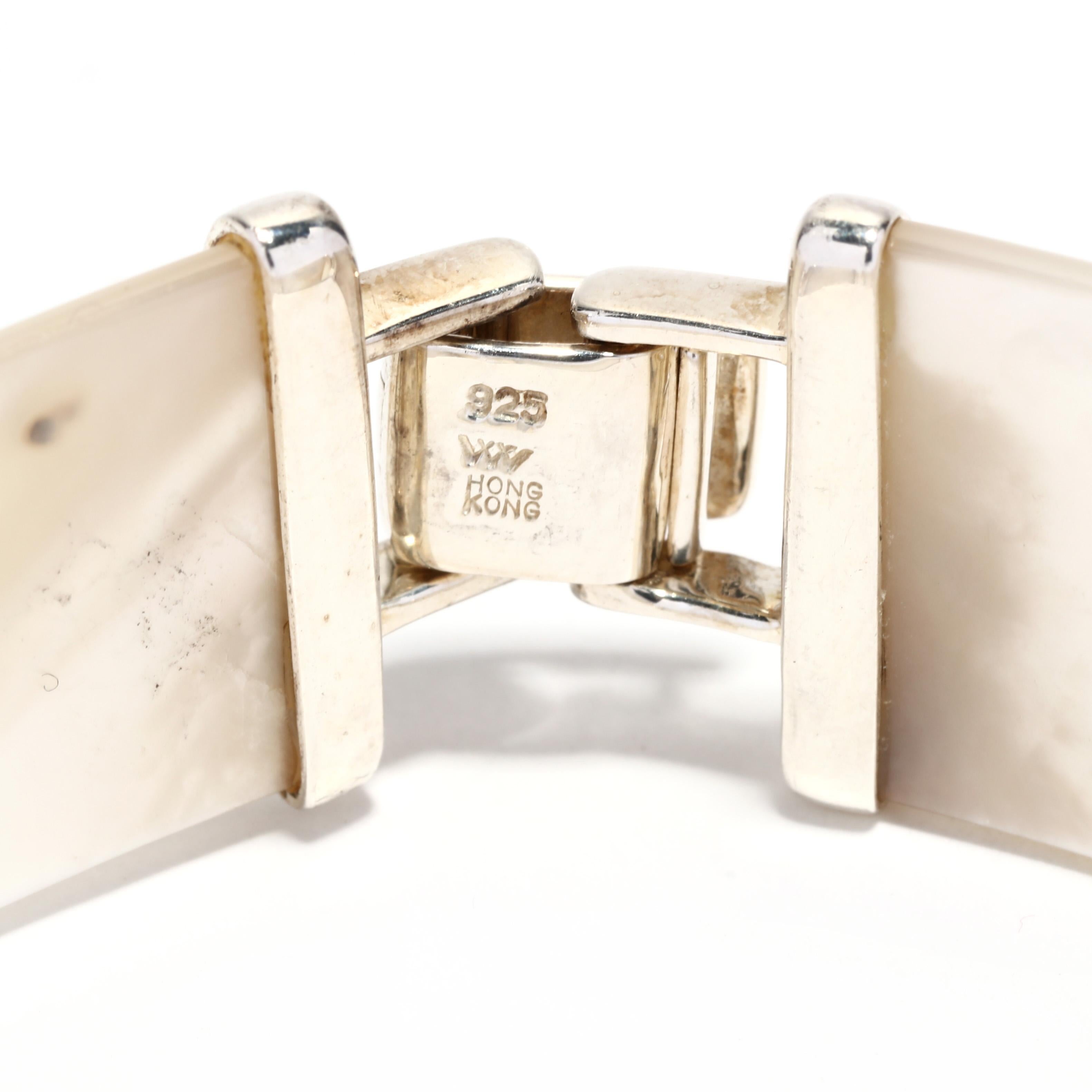 This beautiful vintage mother-of-pearl bracelet is the perfect accessory to any outfit. Crafted with sterling silver, it features classic shell link design with a length of 8 inches. Its simple style and elegant design make it an ideal piece for any