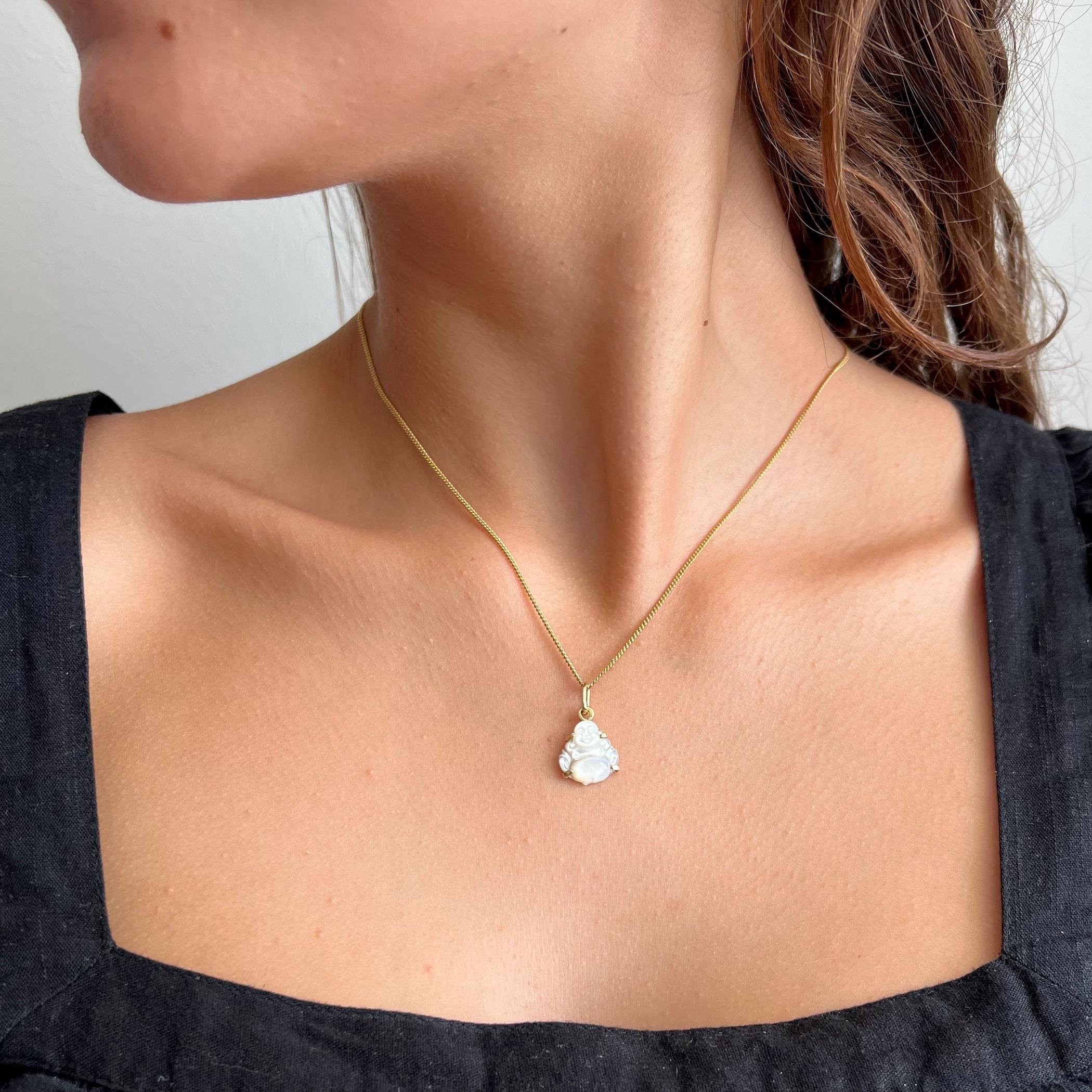 Mother of pearl, is an organic–inorganic composite material produced by some molluscs as an inner shell layer; it is strong, resilient, and iridescent. This vintage buddha charm pendant is made from this beautiful mother of pearl inner shell. The