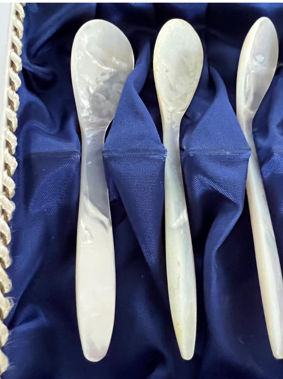 Beautiful vintage set of 6 caviar Mother of Pearl spoons in original box 
Delicate high end spoons that will set your table setup apart !
Original cardboard box with a bright blue satin interior and cording on the edge
 each spoons is about 4.5