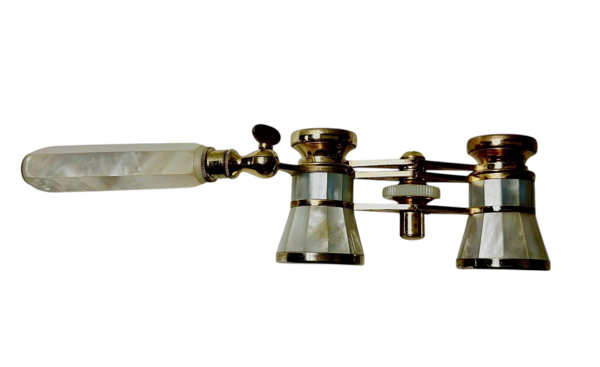 A glam throwback to evenings at the theatre—these vintage opera glasses by TASCO are as chic as they are collectible. Likely dating to the 1970s, this pair features a luminous mother-of-pearl finish with warm toned metal components, possibly brass