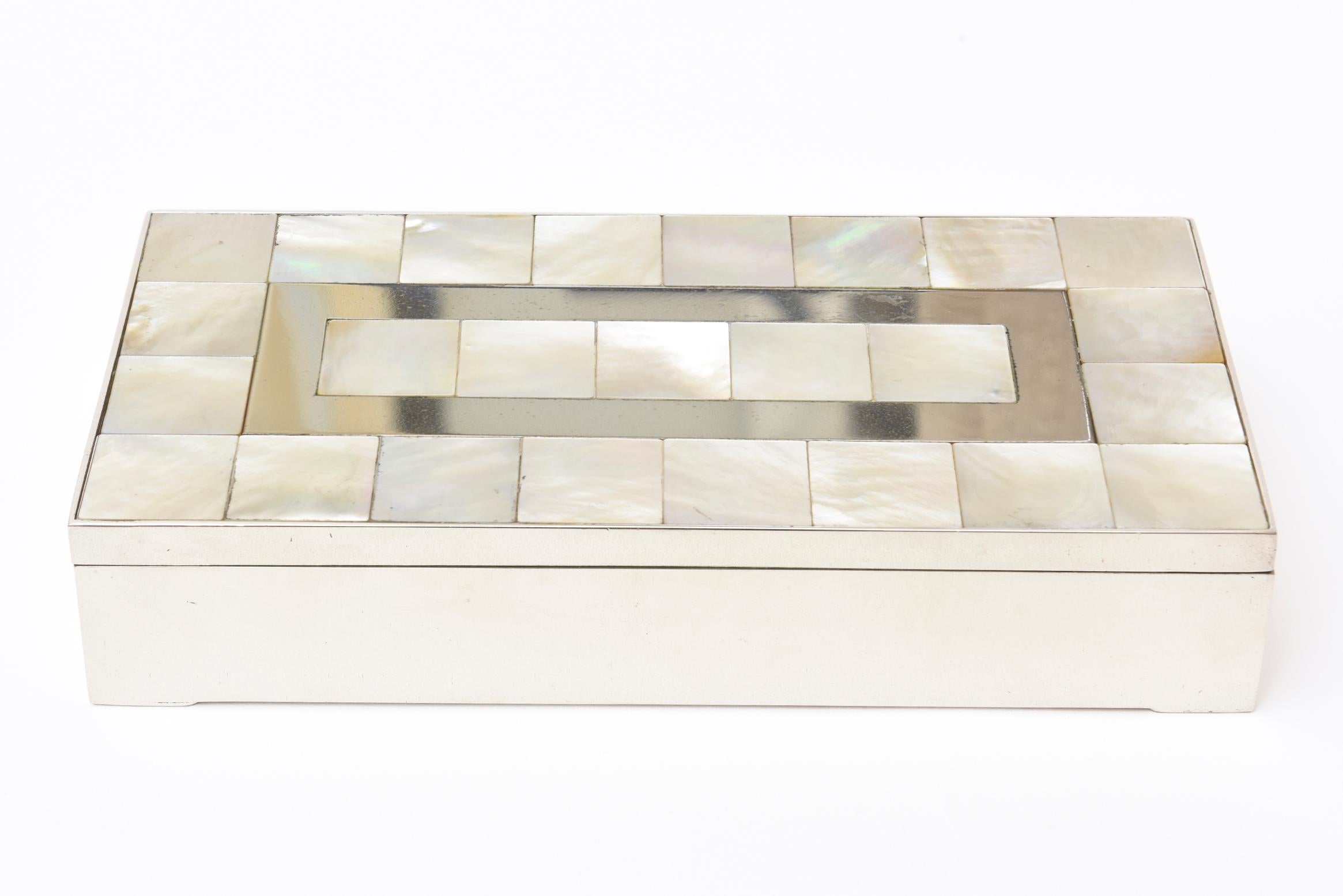 This lovely vintage rectangular mother-of-pearl, nickel silver and wood hinged box is a great object for a desk accessory, console table or a great box for any cocktail table. It has an original light wood interior that has not been restored or