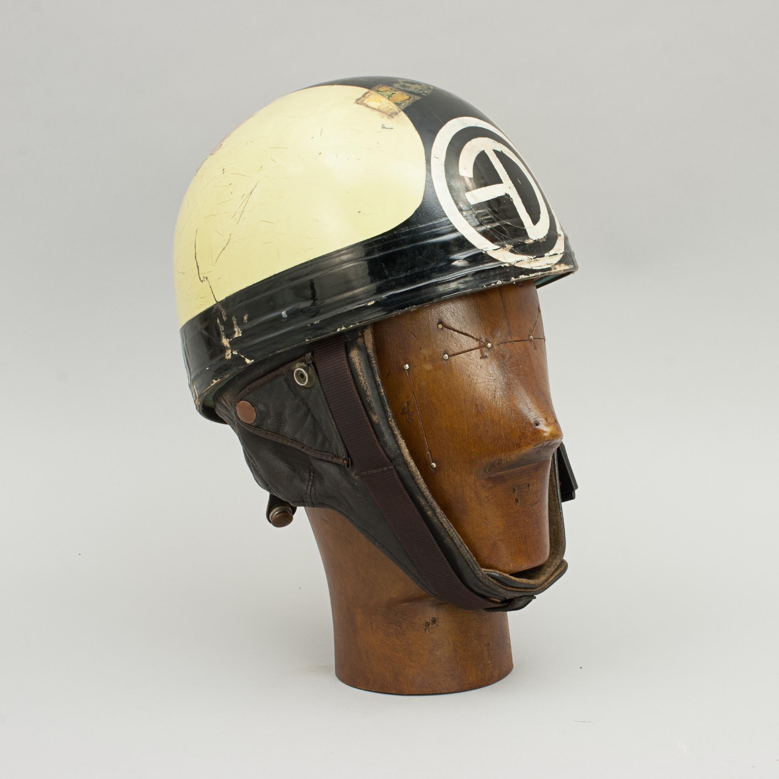 Vintage racing Cromwell crash helmet.
A Manx Grand Prix Motorcycle helmet made in England by Cromwell. This is an ACU approved racing helmet with a Manx Grand Prix scrutineers label on the side, suggesting that it has most probably been used to