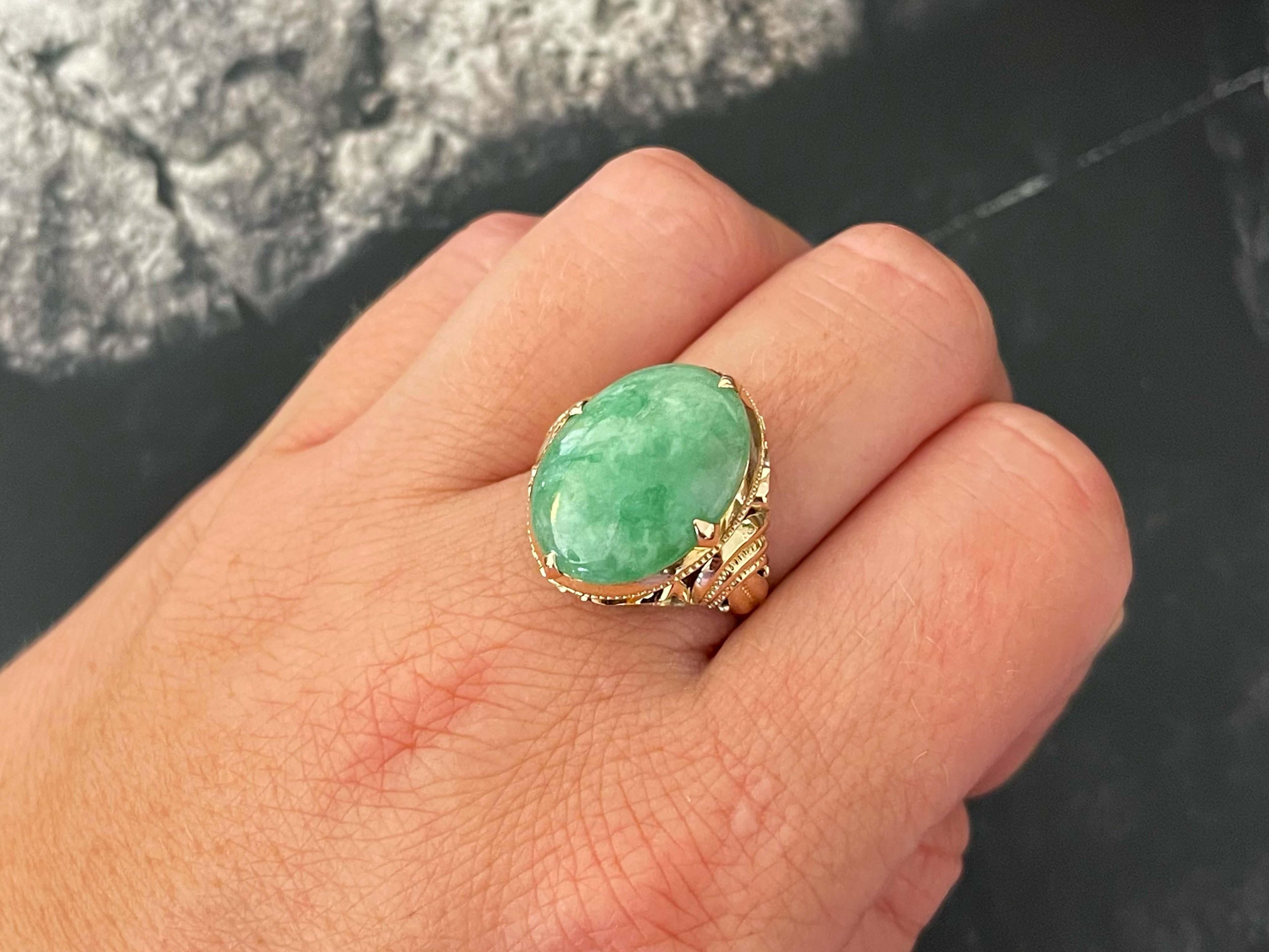 Item Specifications:

Metal: 14K Rose Gold

Style: Statement Ring

Ring Size: 8.5 (resizing available for a fee)

Total Weight: 5.9 Grams

Gemstone Specifications:

Center Gemstone: Jade

Shape: Oval

Color: Mottled Green

Cut: Cabochon 

Gemstone