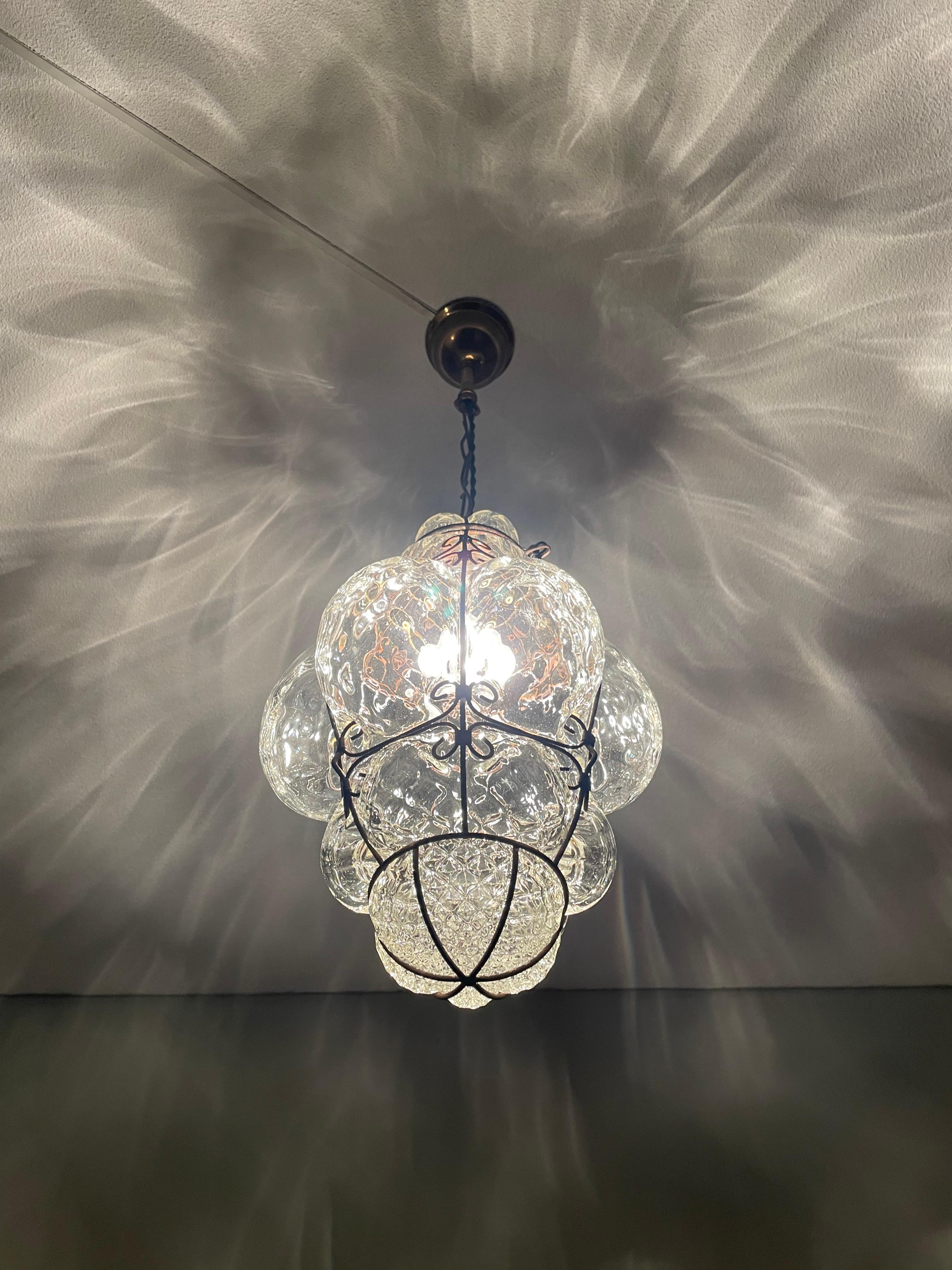 Rare and highly decorative Venetian light fixture with diamond pattern in the glass.

This striking glass art pendant from midcentury Italy is another one of our recent great finds. Handcrafted and mouthblown in one of the Venetian glass art studios