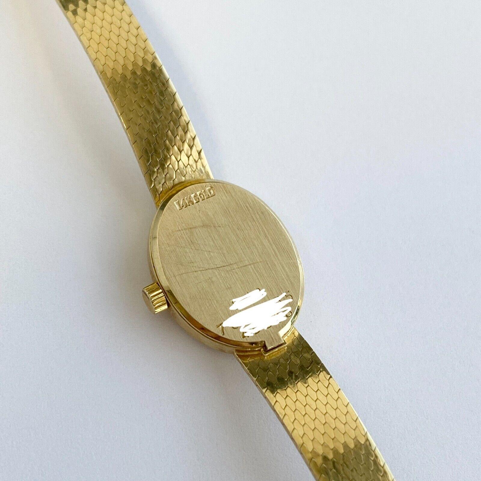  Movado Montre vintage pour femme en or jaune massif 14 carats avec bracelet en maille de quartz et quartz Unisexe 