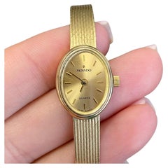 Movado Montre vintage pour femme en or jaune massif 14 carats avec bracelet en maille de quartz et quartz