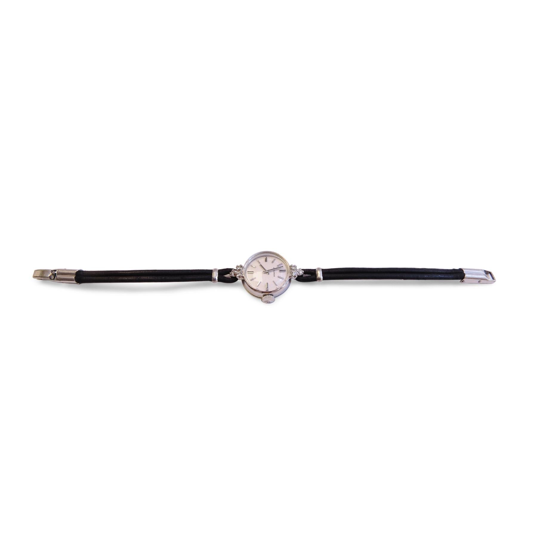 Movado 
14K White Gold 
Diamond= 0.15 ct total
Width Mechanism
Black Leather 
Dial= 17mm   
