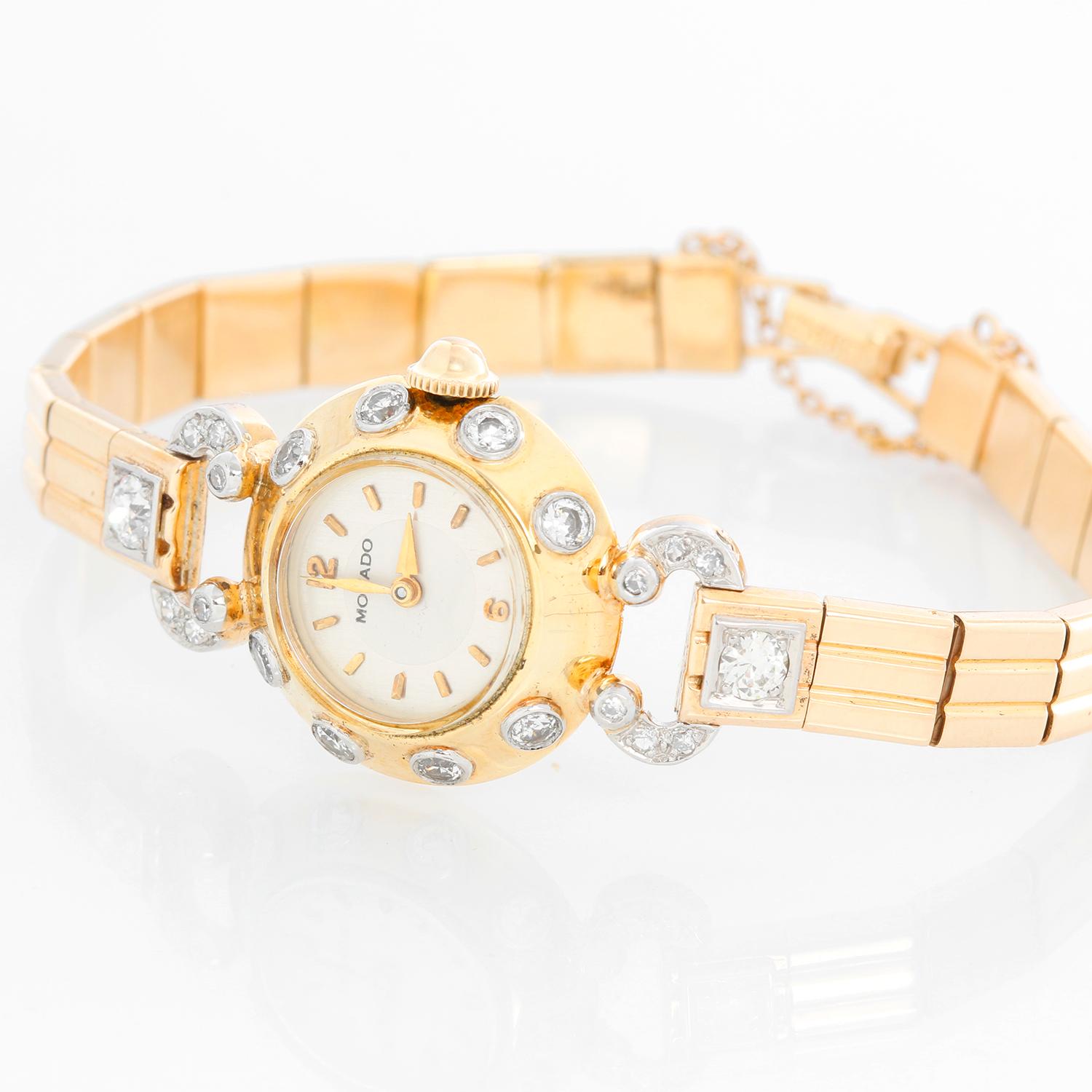 Vintage Movado Art Deco Diamond Ladies Watch - Manual winding. 14K Yellow gold with diamond bezel and diamond lugs ( 20 mm ). Two tone silver dial with stick hour markers. 14K link bracelet. Will fit a 6 1/4 inch wrist and we can add two more links.