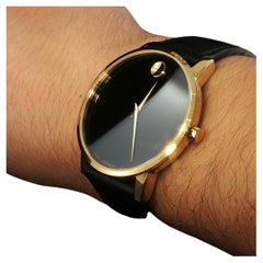 Reloj Movado vintage de colección, con esfera negra clásica y acabado dorado, de cuarzo suizo, 40 mm