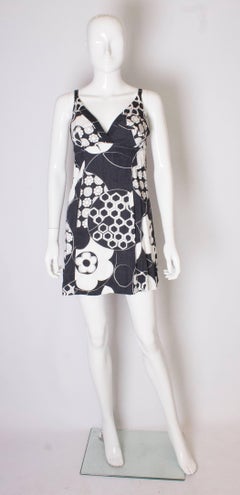 A Vintage 1960s black and white floral printed mini dress by Mr Leonard