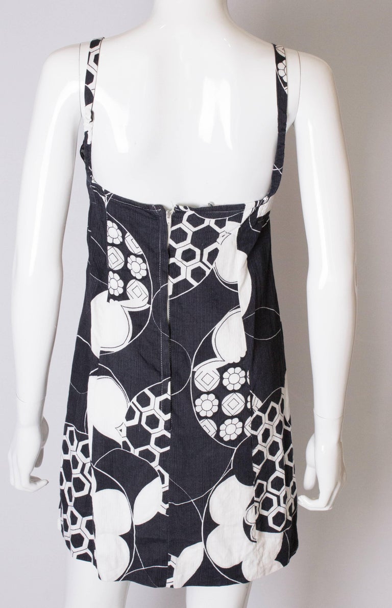 A Vintage 1960s black and white floral printed mini dress by Mr Leonard ...