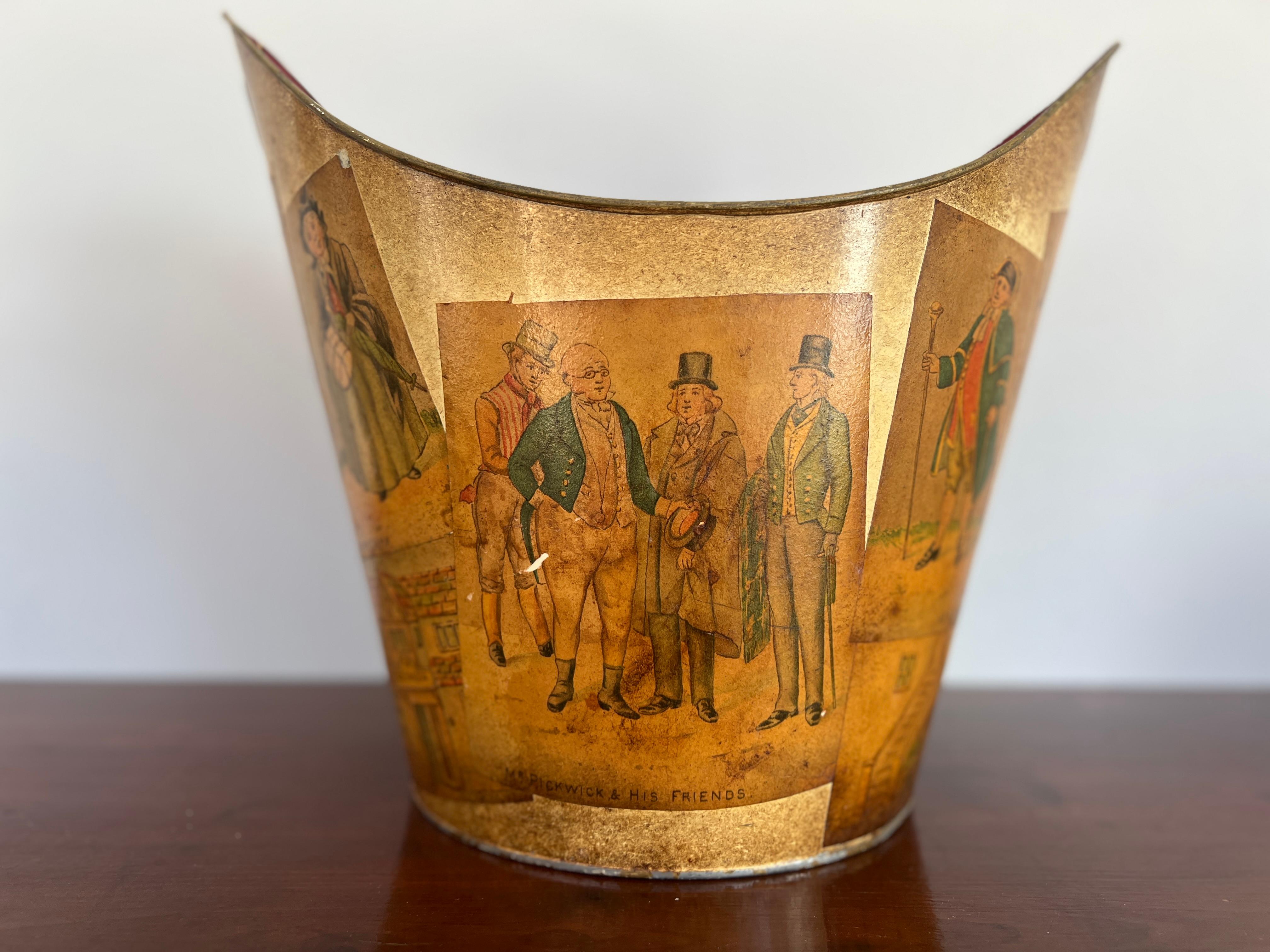 Italian, early to mid 20th century.

A vintage yellow tole bucket or trash can adorned with paper mache Mr. Pickwick & Friends decorations to exterior and a red interior. Otherwise unmarked.