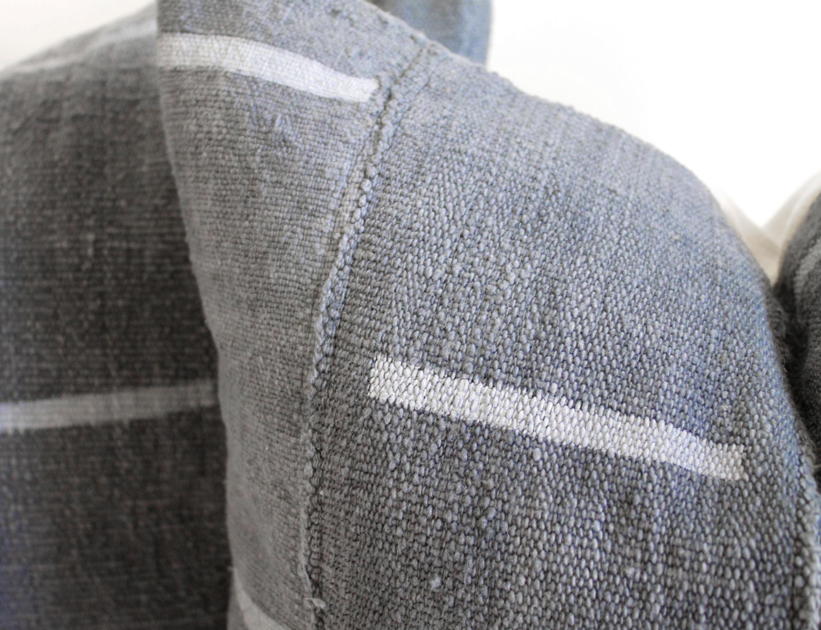 This cotton face features a deep moody gray blue with light gray stripes. The backing is 100% Irish linen in natural linen. Our pillows are constructed with vintage one of a kind textiles from around the globe. Carefully constructed with the finest