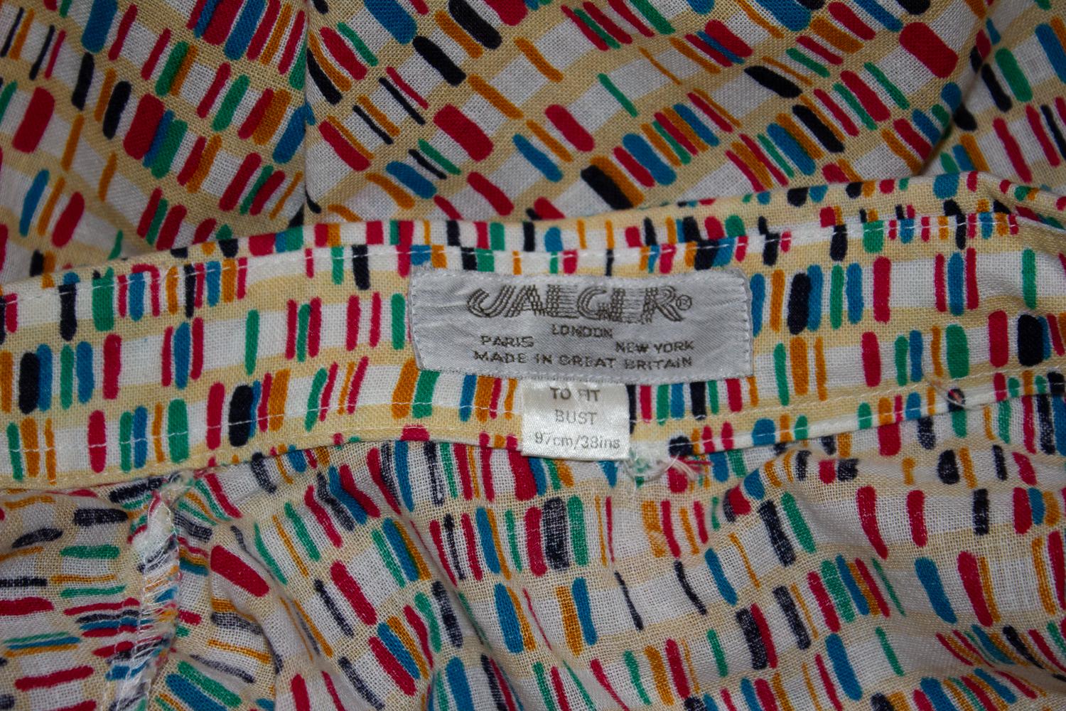A great vintage blouse by British from Jeager.  In a wonderful multicolour palette, and design. The blouse is made of cotton .  It has a button front opening , and short selves with turnback cuffs.
Measurements: Bust up to 38'', length 22''