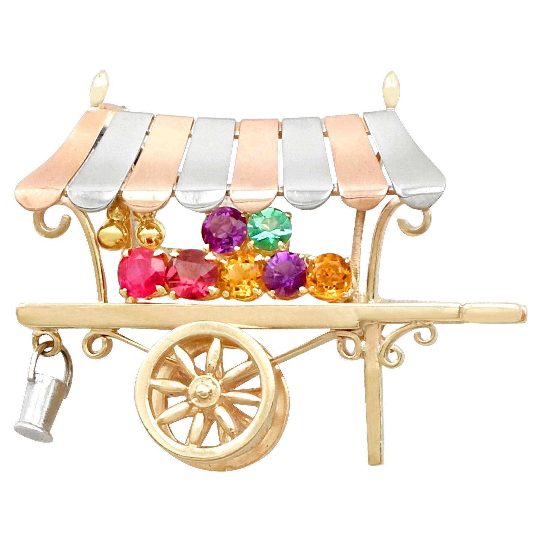 Vintage Multi-Gemstone and Yellow Gold 'Cart' Brooch by Alabaster and Wilson For Sale