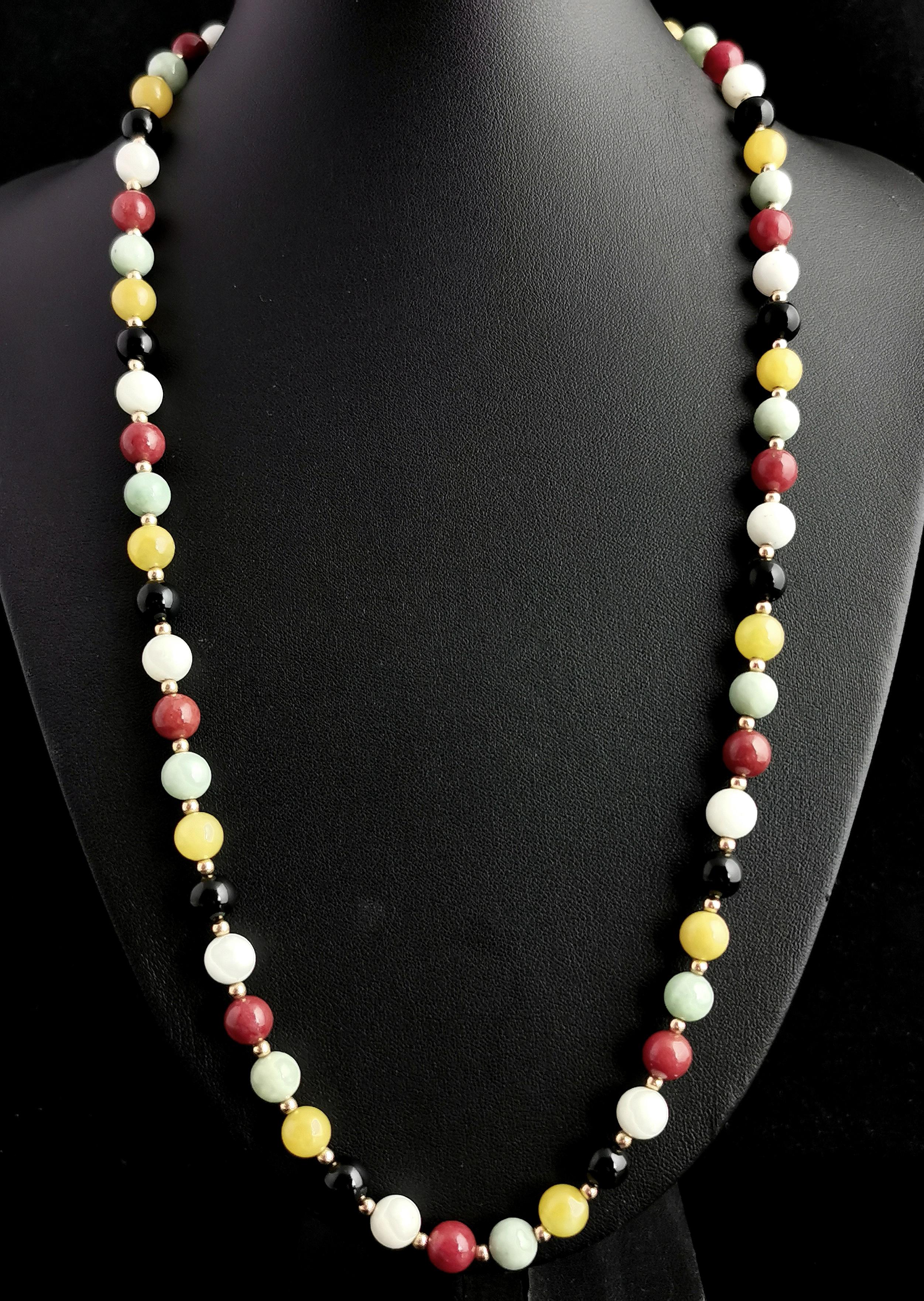 A gorgeous, fun and vibrant multi gemstone bead necklace.

There is an array of different colours and gems on this piece giving it an uplifting and happy feel to it.

The beads consist of yellow agate, onyx, Carnelian, rock crystal and