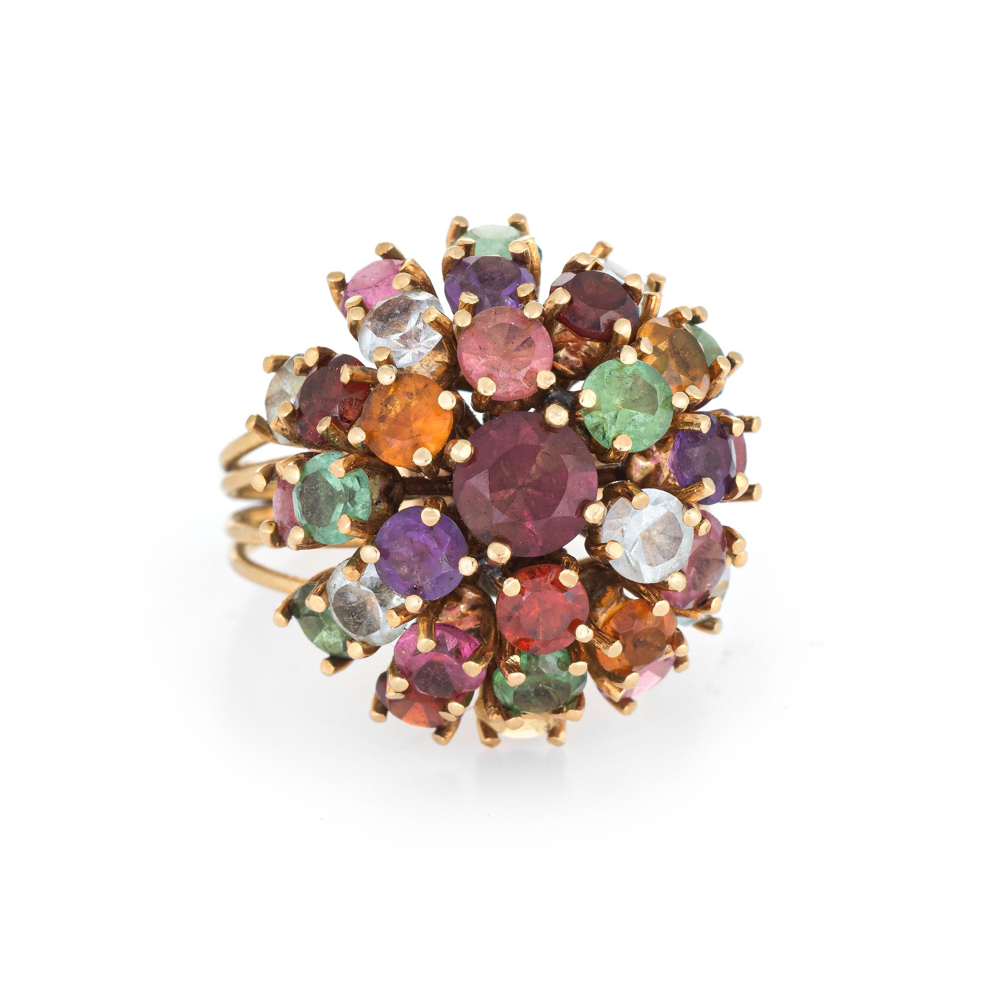 Stylish vintage multi gemstone cocktail ring (circa 1950s to 1960s) crafted in 18 karat yellow gold. 

Multi gemstones are estimated at 0.20 carats each (pink & green tourmaline, garnet, white topaz, amethyst & citrine) totaling an estimated 6