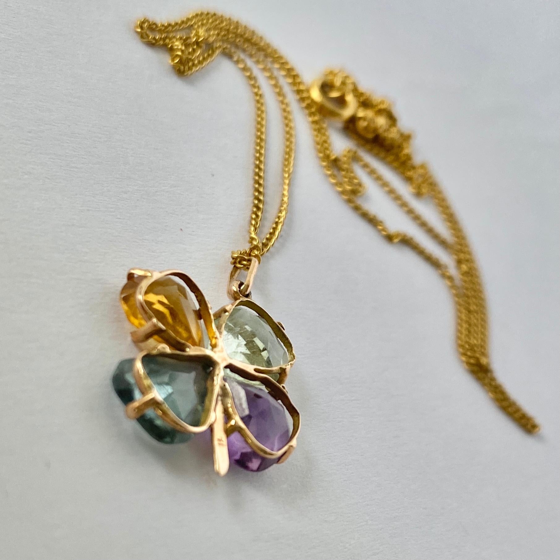This stunning four leaf clover holds a petal shaped citrine, topaz, quartz and amethyst. The pendant and chain are modelled in 18ct gold. 

Chain Length: 47cm
Pendant Dimensions: 17x16mm

Weight: 3.4g