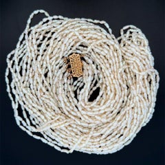 Vintage Multi Strand Keshi Pearl Necklace held by 14K Gold Clasp