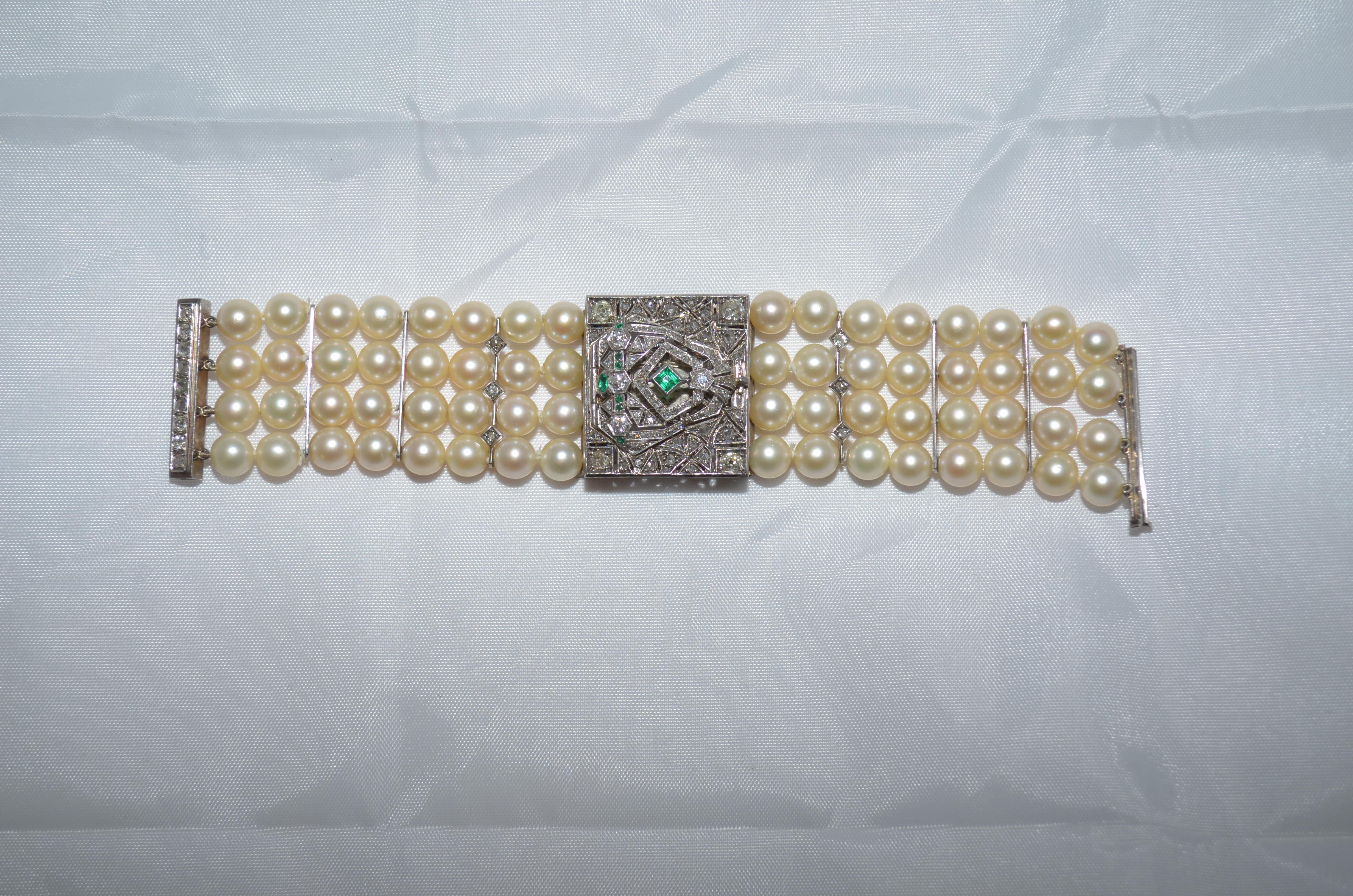 14kw gold Art Deco diamond, emerald and pearl watch. The featured watch has 8 AA quality emeralds with carat weight of .40 carats. There are 143 diamonds measuring 4mm to .5mm with clarity range of Si1 to I4, a color range of H to L, and an