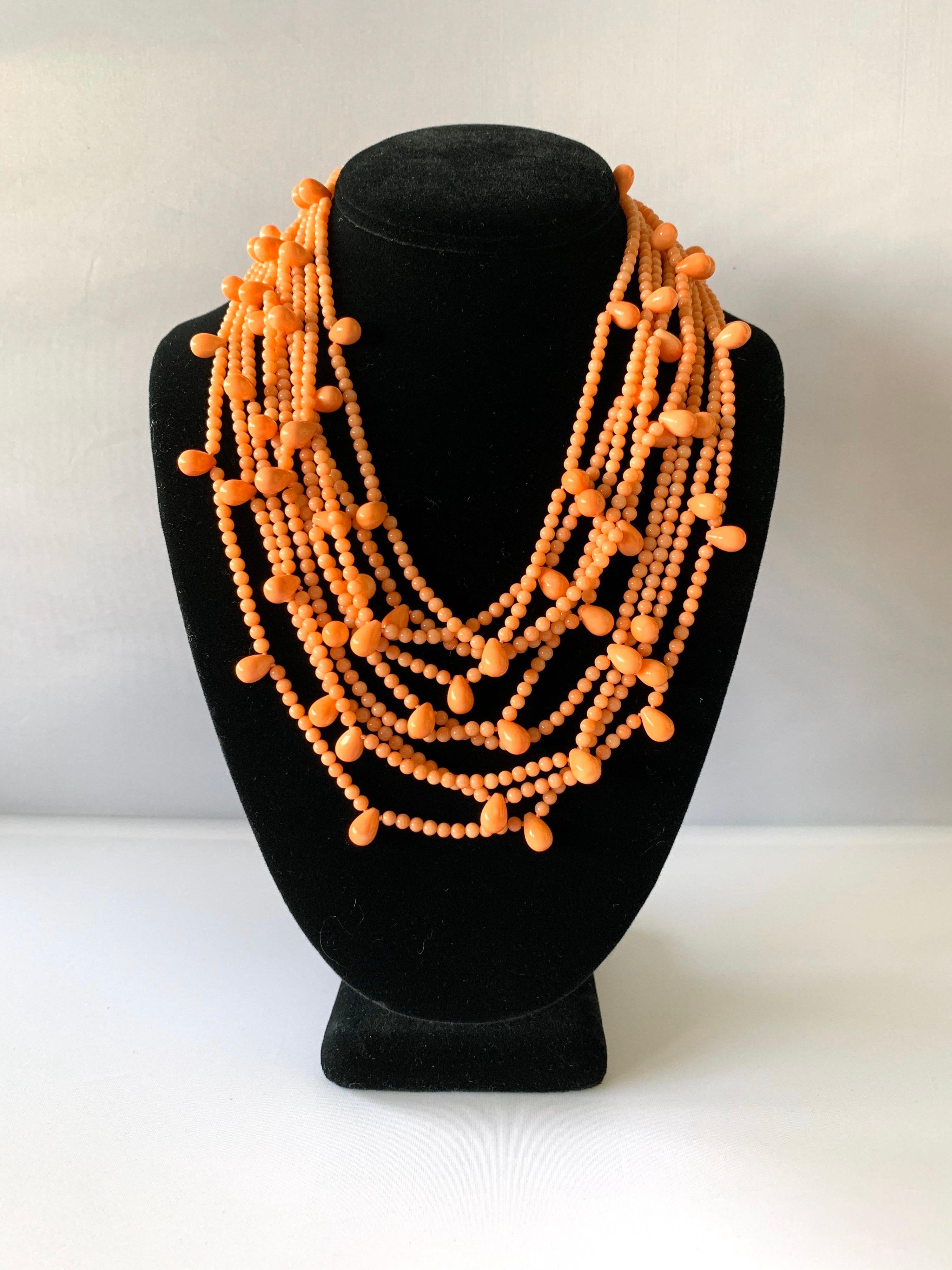 Beautiful vintage multi-strand pink coral bib necklace - comprised out of nine strands of pink coral beads. The necklace features a unique design due to the coral beading, the clasp is 14k gold (marked 585).