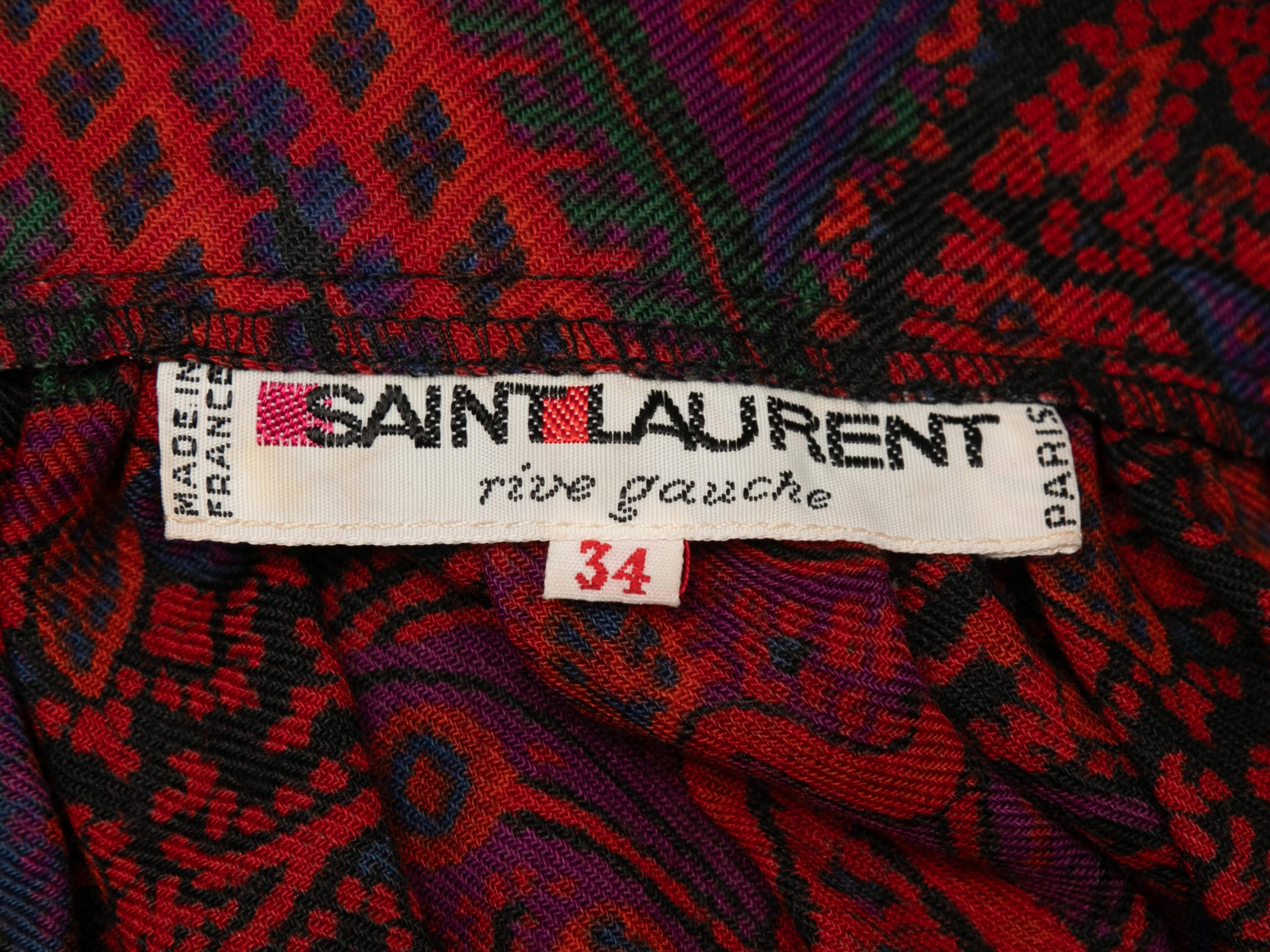 Vintage red and multicolor paisley print maxi skirt by Saint Laurent. From the 1976 Russian Collection. Side closure. 24