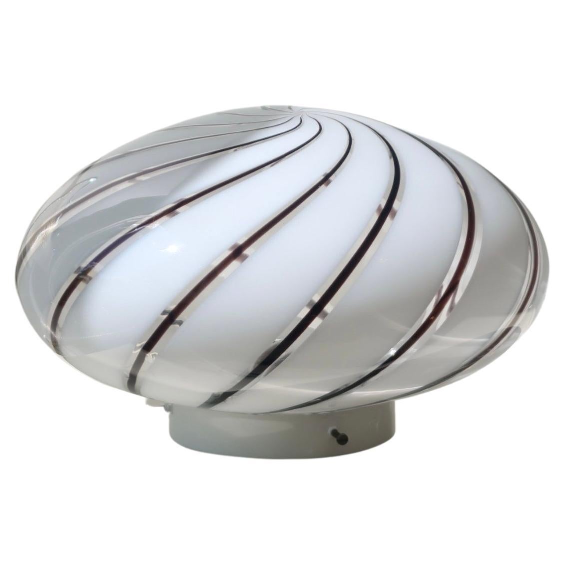 Vintage Murano plafond ceiling lamp / wall lamp. Mouth-blown white opal glass with dark swirl and white base. Handmade in Italy, 1970s. Measures: D:32 cm?? H:20 cm.



