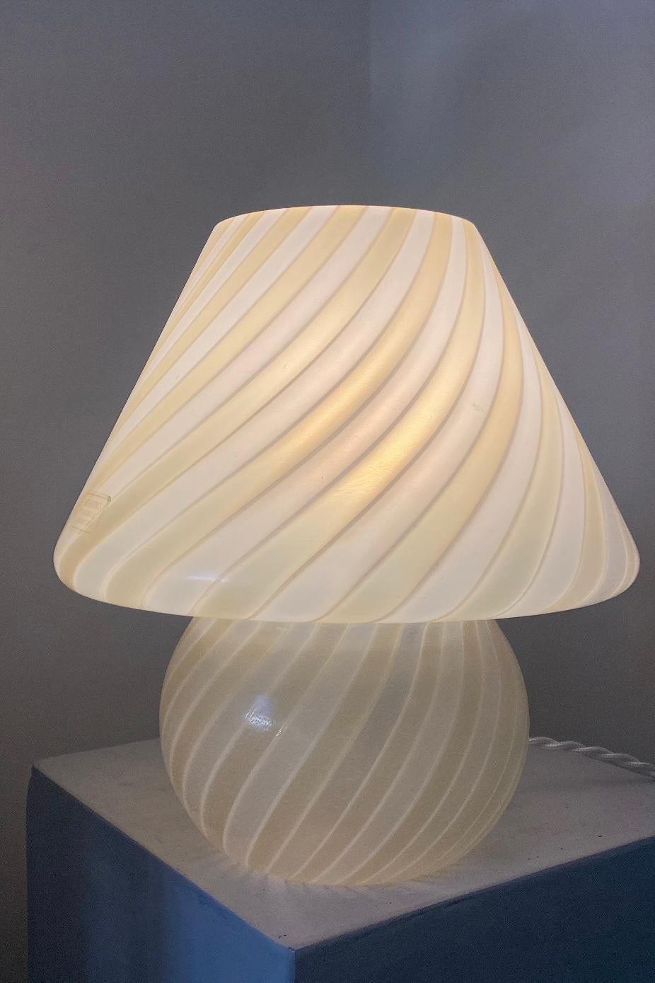 Vintage medium Murano mushroom table lamp in a special combination of white and cream yellow. Mouth-blown in one piece of glass with a swirl pattern. The lamp has an original Murano label. Handmade in Italy, 1960s/70s, and comes with new white