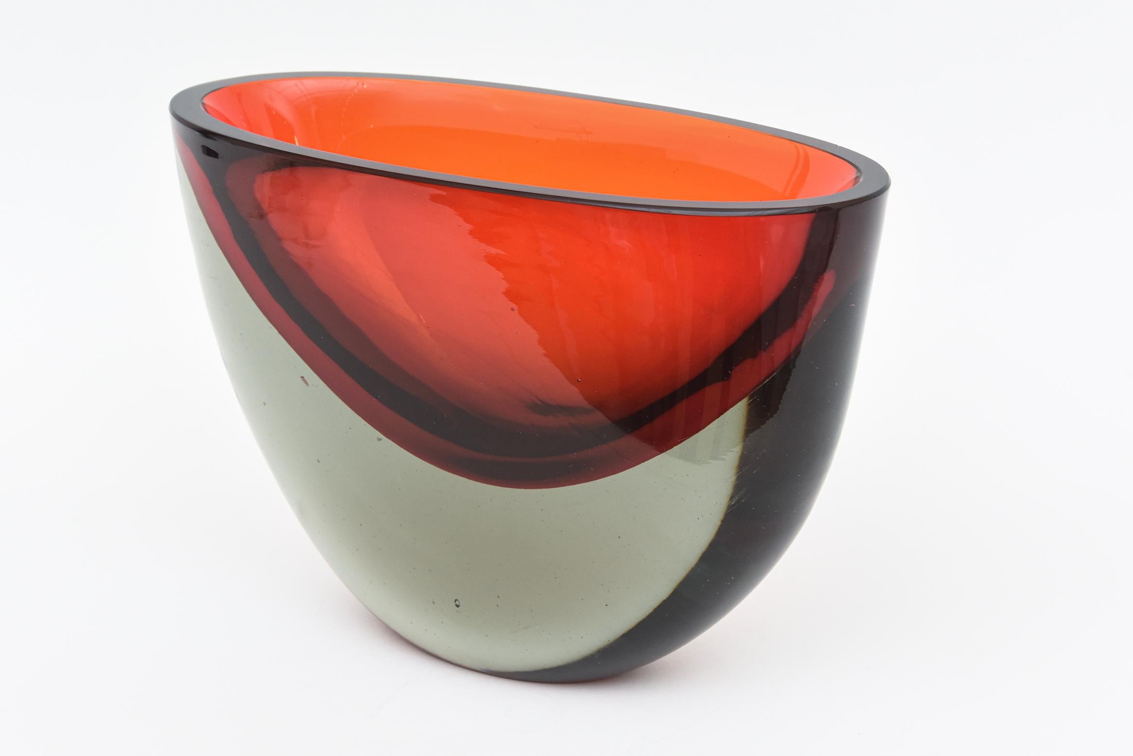 This very rare and heavy Italian Murano hand blown glass vase or vessel is by Antonio da Ros for Cenedese and is vintage from the 70's. It is flat cut polished top and has the sommerso technique ranging from gradients of red, red orange to dark gray