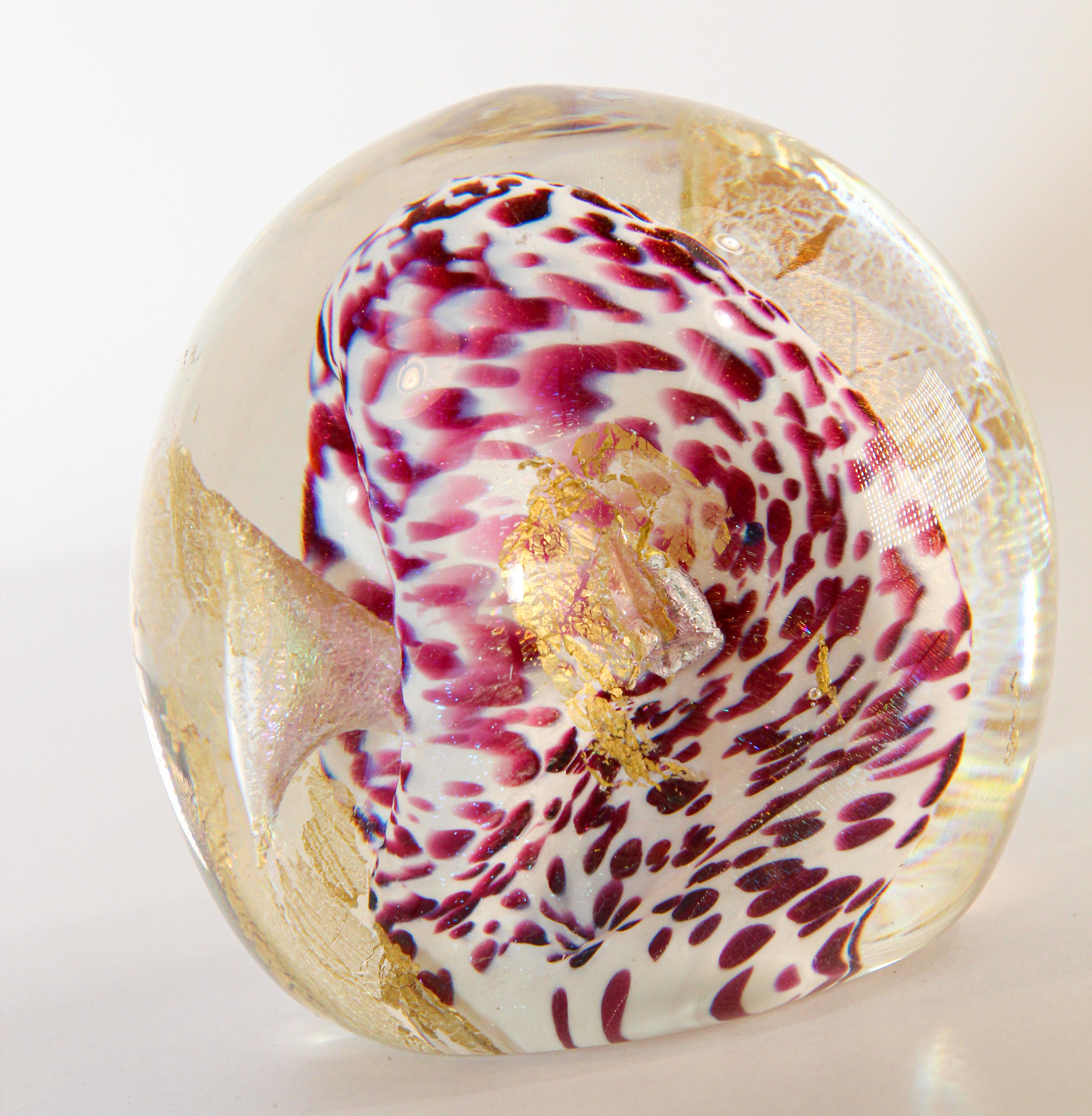 Gorgeous Vintage Art Glass 1993 abstract design paperweight. 
Beautiful handcrafted pink and white swirl Murano art glass paperweight. 
Signed by the artist dated 1993.
Measures: diameter 3 in. x 3in. height.
A beautiful nice addition to your