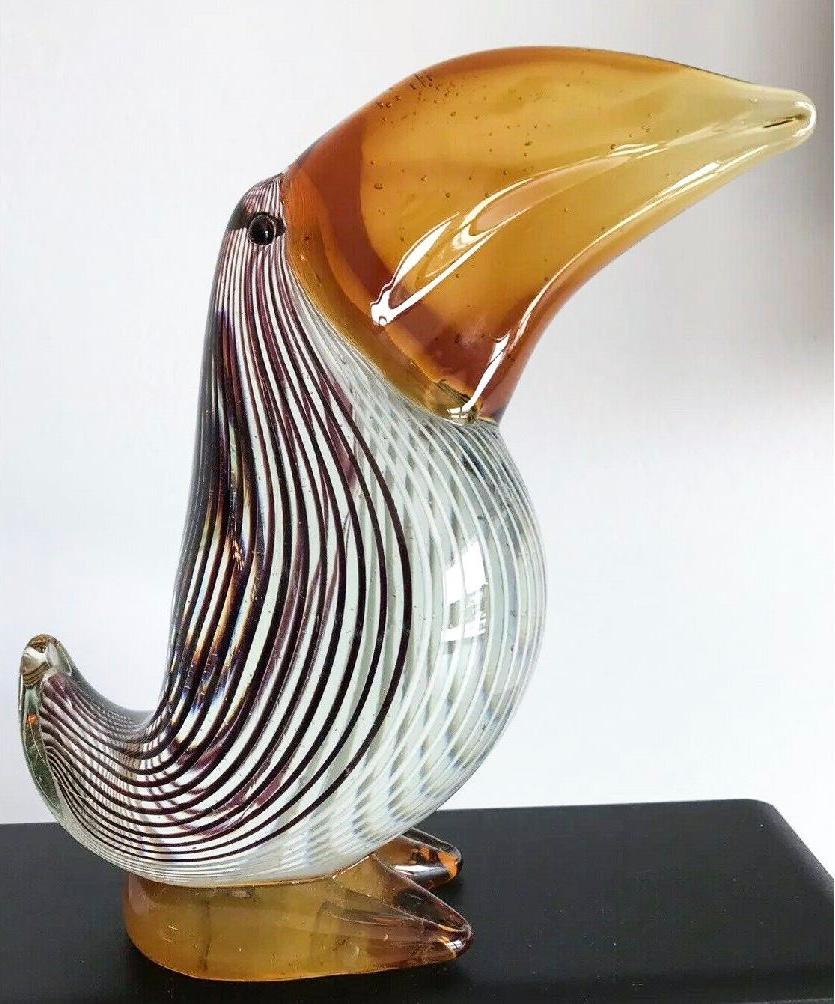 Gorgeous vintage Murano Art Glass pelican by Dino Martens, trademark black on white striped central mass with stylized amber Glass beak and foot / base. Gorgeous midcentury piece.