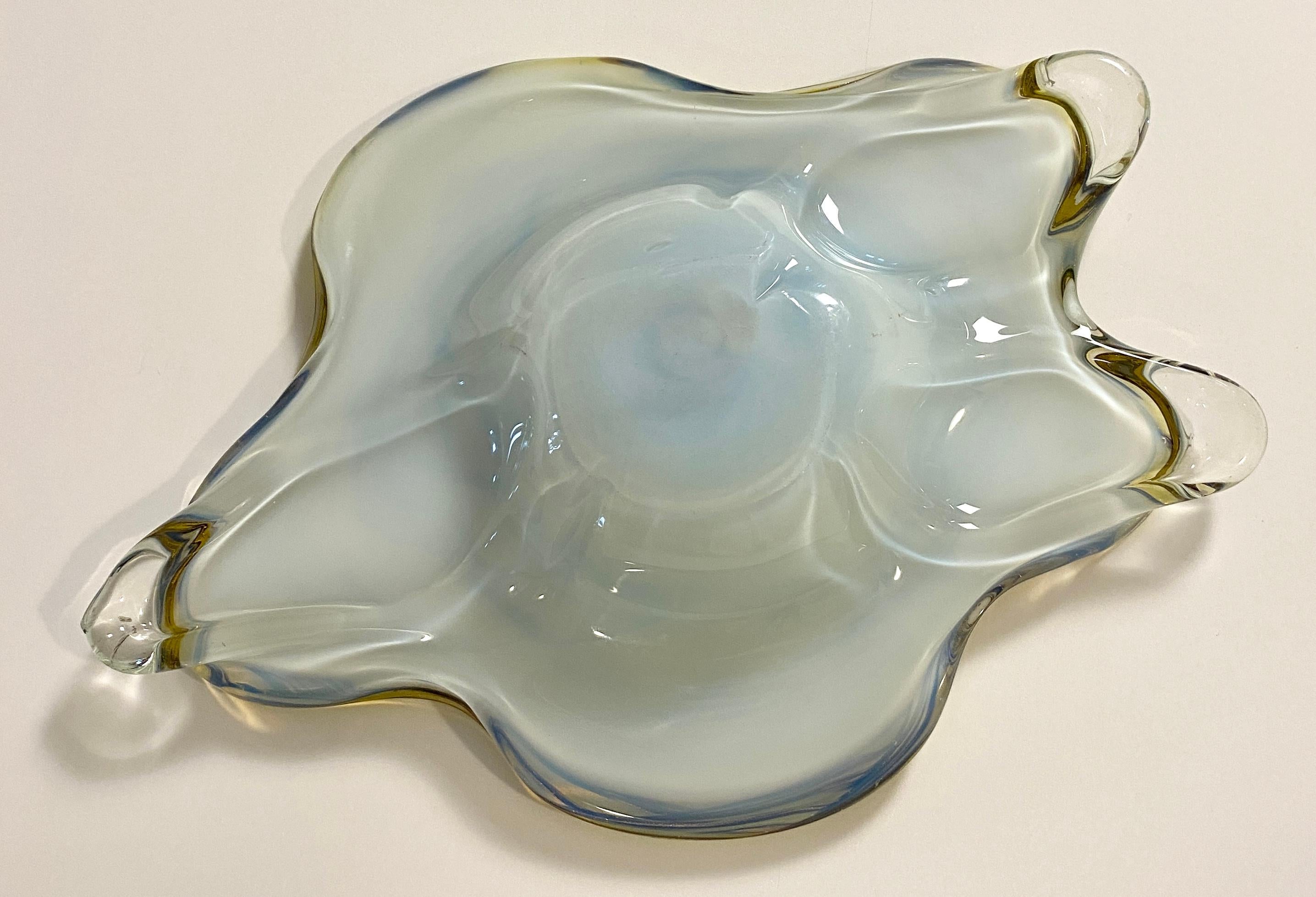 A beautiful Murano art glass bowl, key holder or vide poche. 
Stunning colors, yellow and clear art glass makes this blown art glass particularly eye-catching. 

Use it as a decorative bowl on a cocktail table, counter top or shelf. In your home